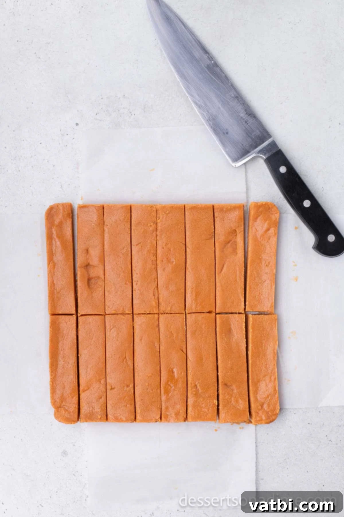 DIY Butterfinger Bars 6 Hardened peanut butter and candy corn mixture cut into individual bars.