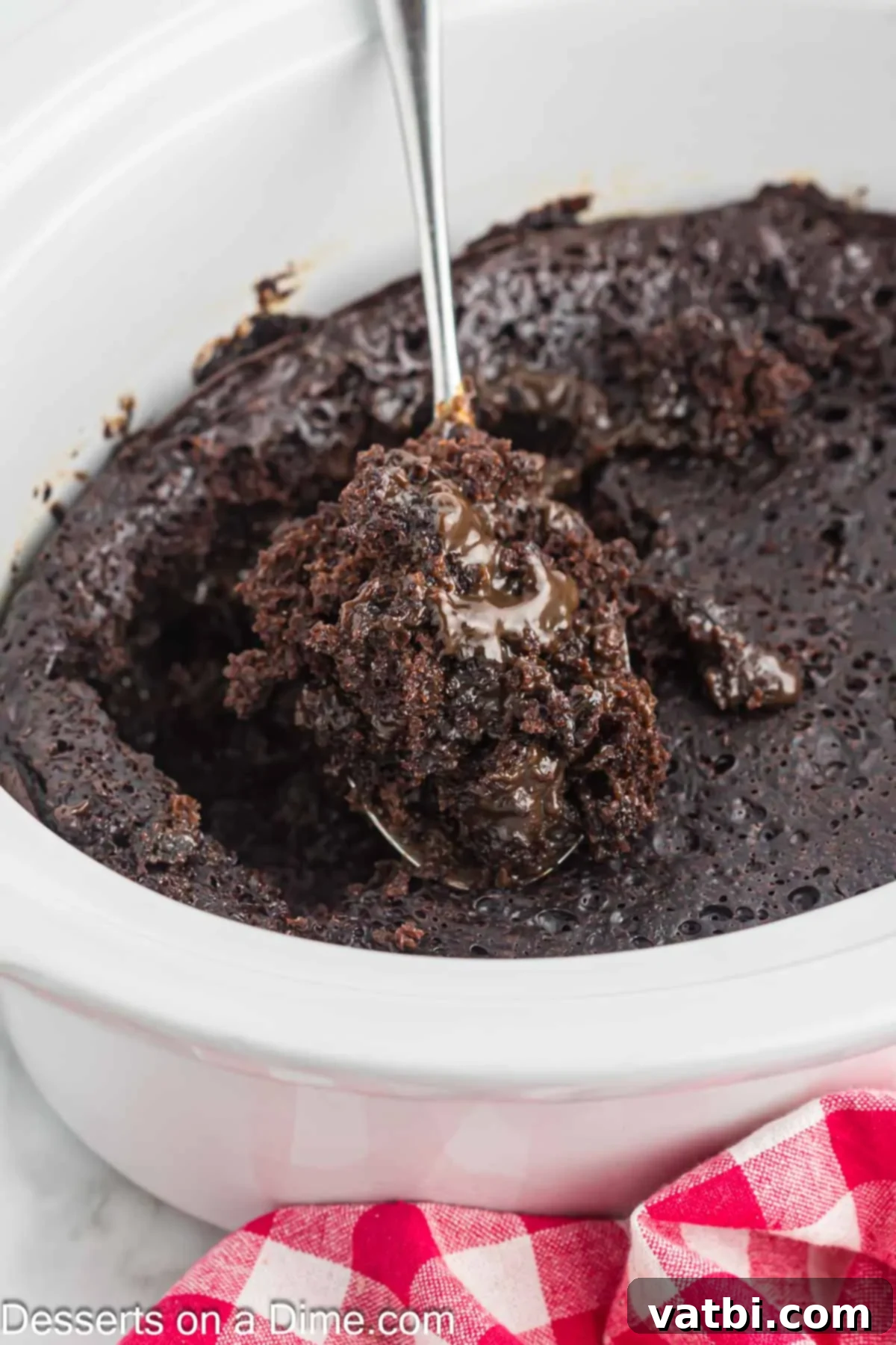 Crock-Pot Molten Chocolate Dream 2 Crockpot with lava cake inside, showing the rich, dark chocolate interior.