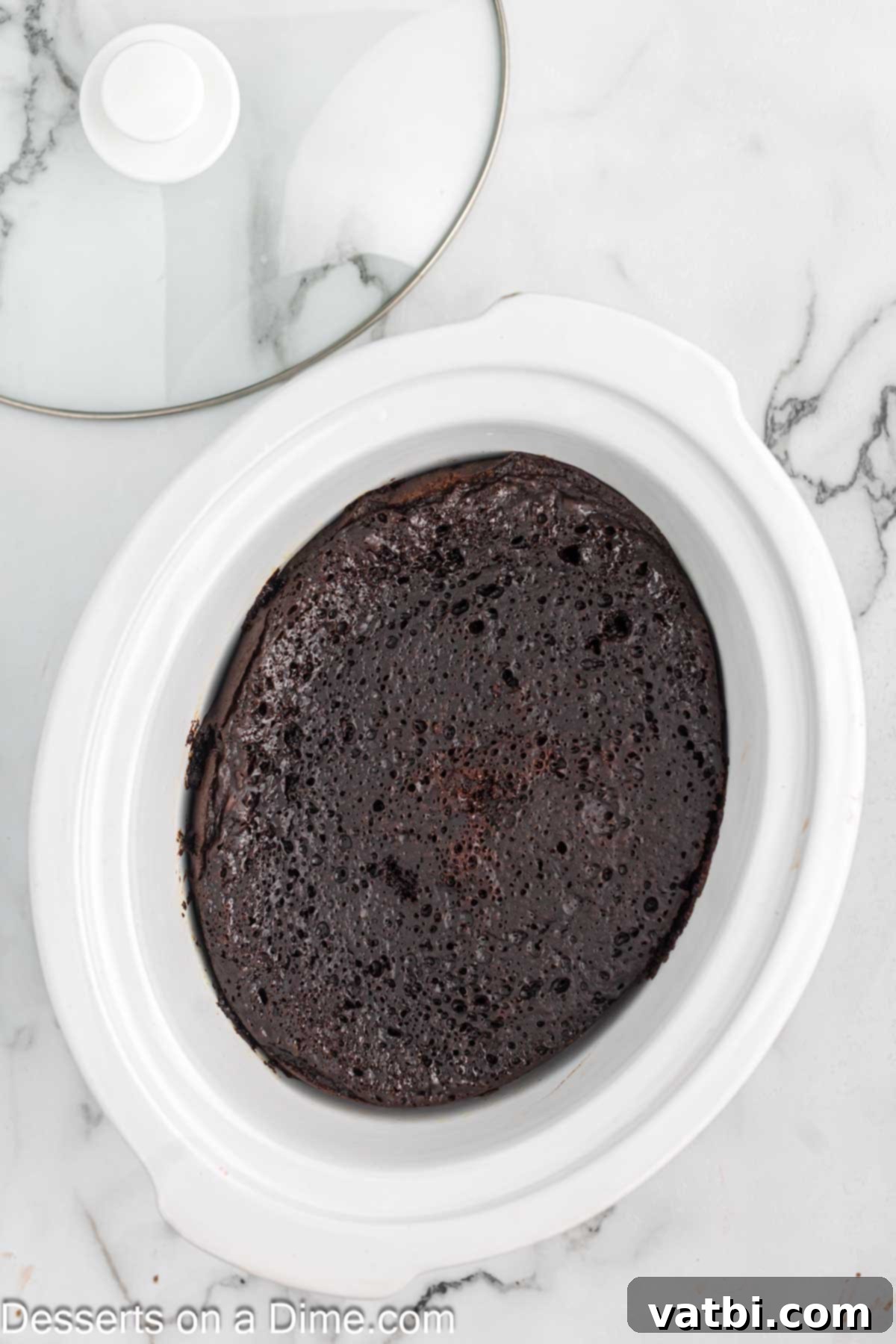Crock-Pot Molten Chocolate Dream 8 Slow cooker with the lid on, cooking the lava cake.