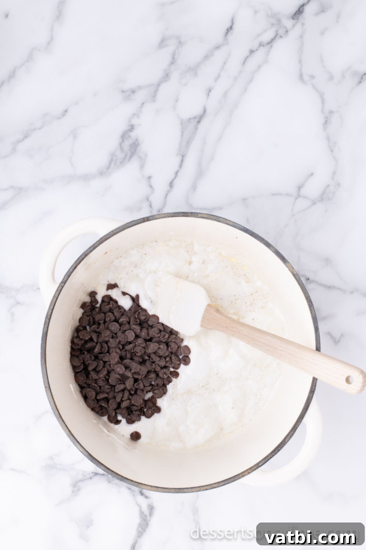 Chocolate mixture combined in pan. 