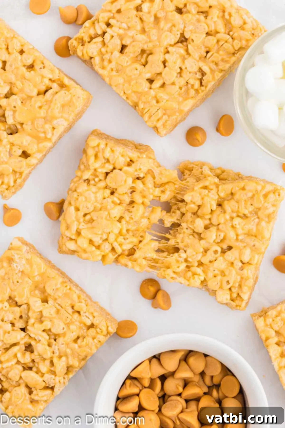 Gourmet Brown Butter Rice Krispie Treats 2 Brown Butter Rice Krispy Treats cut into squares, showcasing their golden-brown color and chewy texture.
