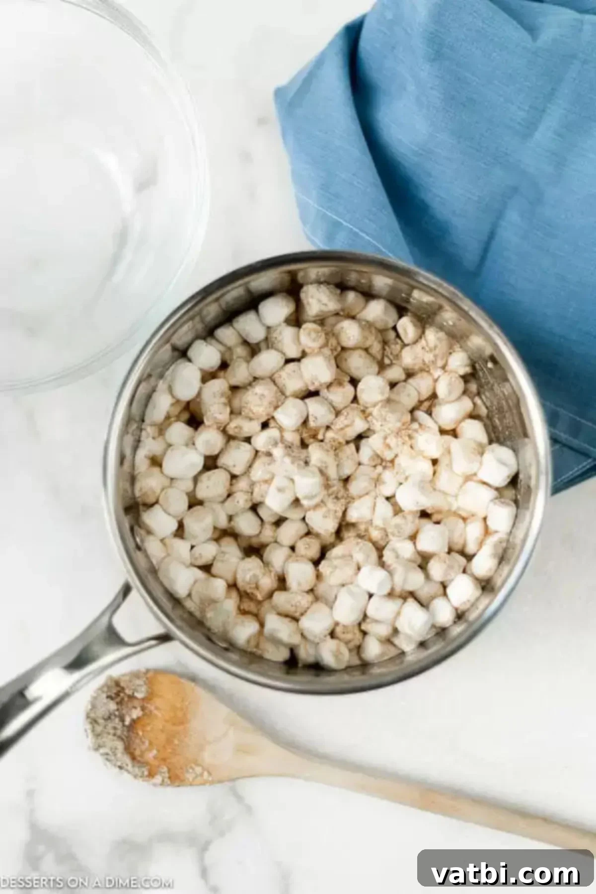 Gourmet Brown Butter Rice Krispie Treats 5 Mini Marshmallows added to melted brown butter in a saucepan.