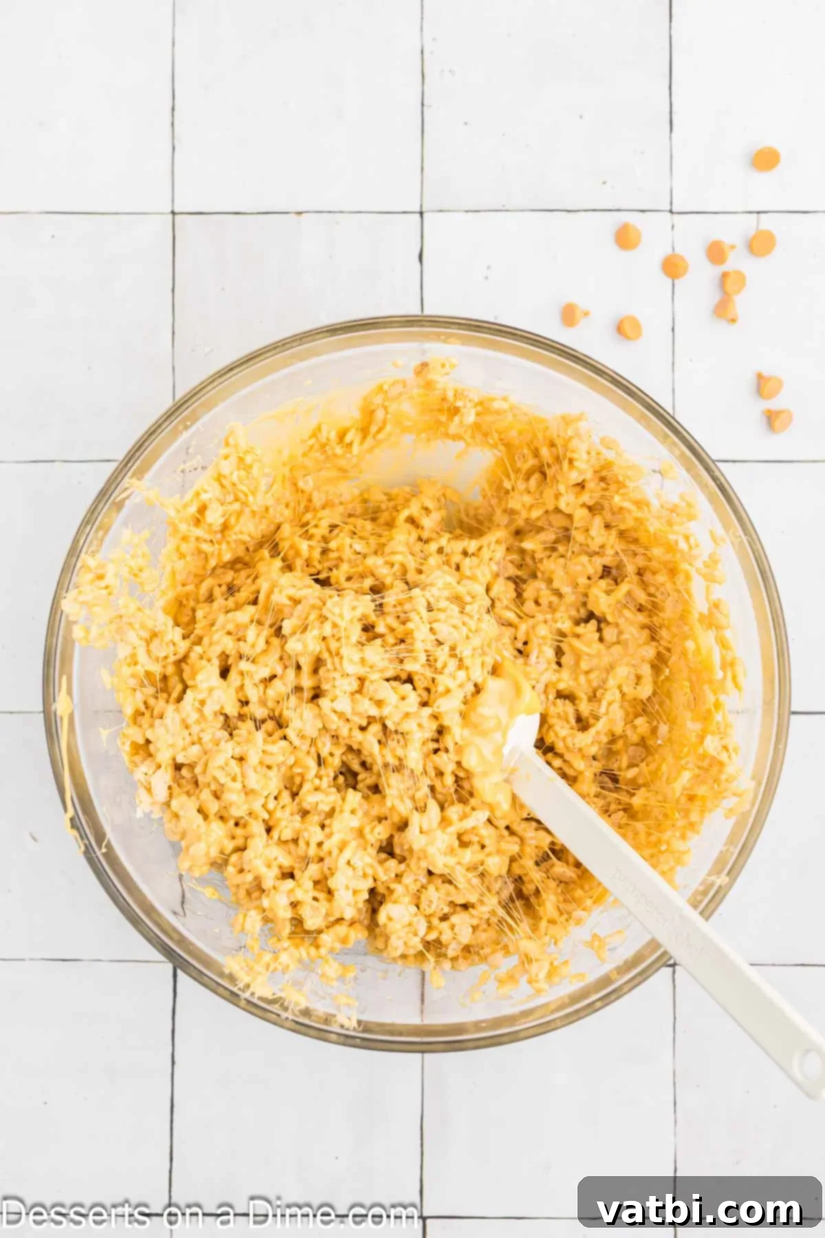 Gourmet Brown Butter Rice Krispie Treats 6 Rice Krispies cereal added to the marshmallow mixture and being combined.
