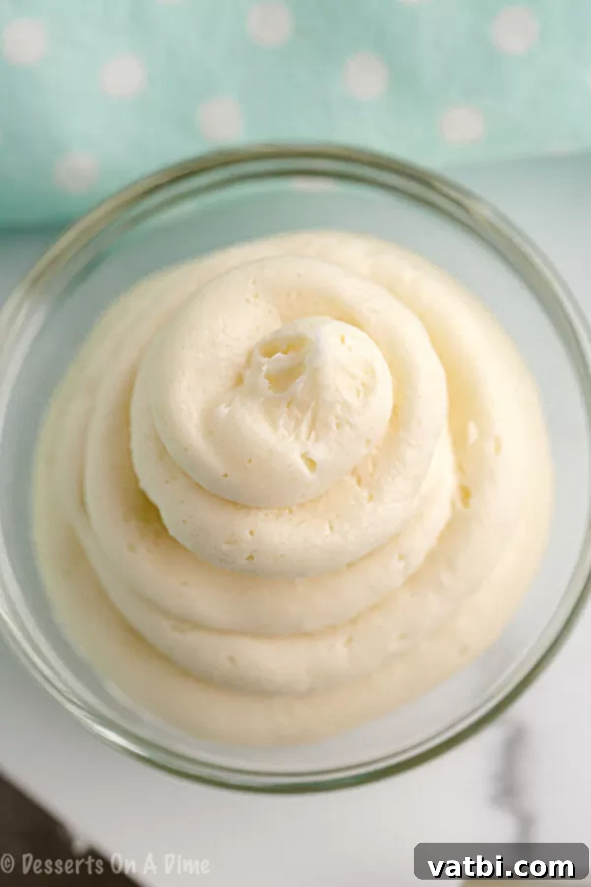 You are going to love this Keto Cream Cheese Frosting recipe. It's only 4 ingredients to make this easy low carb icing. It's perfect for keto desserts! You’ll love this Keto and gluten free cream cheese frosting recipe. #eatingonadime #ketorecipes #ketodesserts Keto frosting in a bowl ready to use.
