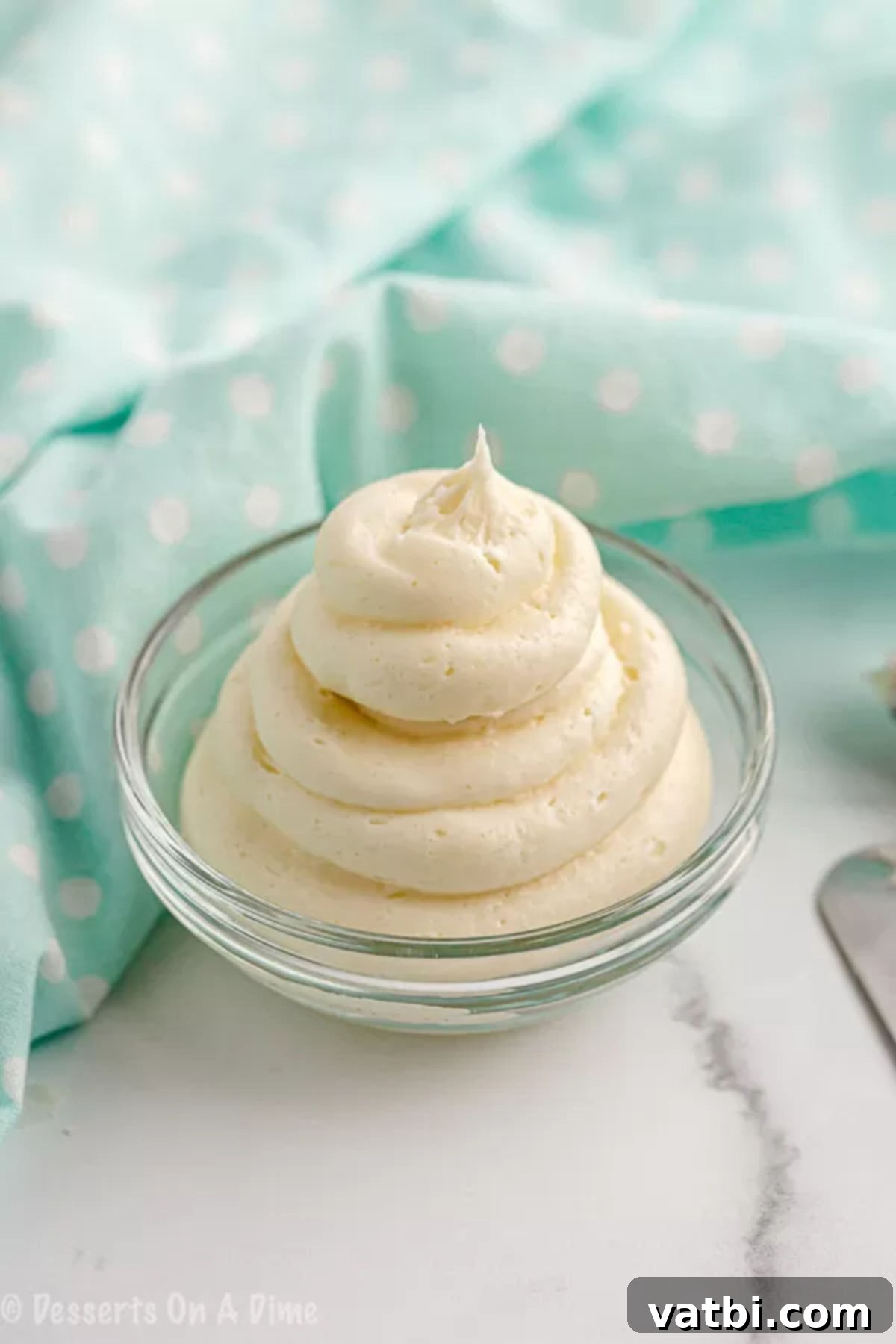 You are going to love this Keto Cream Cheese Frosting recipe. It's only 4 ingredients to make this easy low carb icing. It's perfect for keto desserts! You’ll love this Keto and gluten free cream cheese frosting recipe. #eatingonadime #ketorecipes #ketodesserts Frosting ingredients combined in a bowl and ready to use.