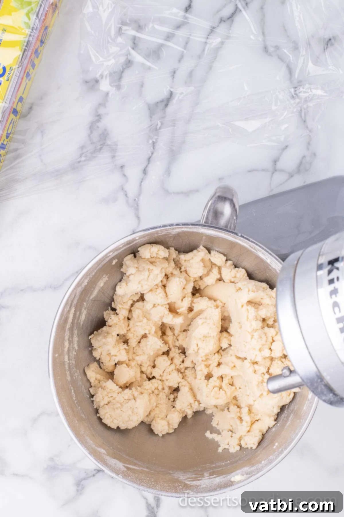 Sweetheart Sugar Cookie Delights 7 Dry and wet ingredients added together in mixing bowl.