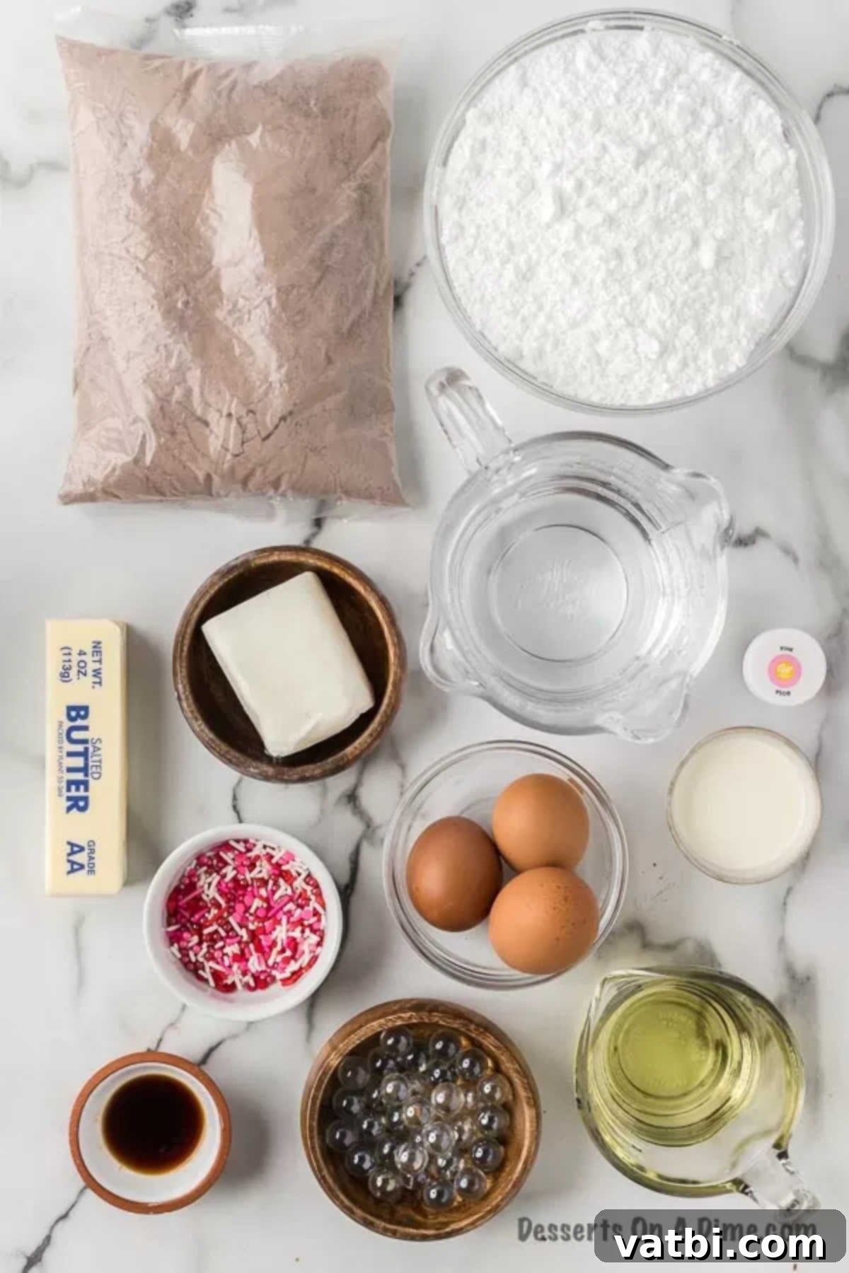 Ingredients for recipe: cake mix, powdered sugar, eggs, oil, butter, seasoning, pink food coloring, and sprinkles.