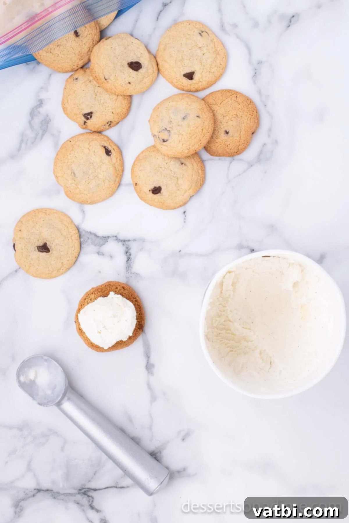 Perfect Homemade Chipwich Delight 12 Vanilla ice cream being scooped and placed onto one of the chilled chocolate chip cookies.