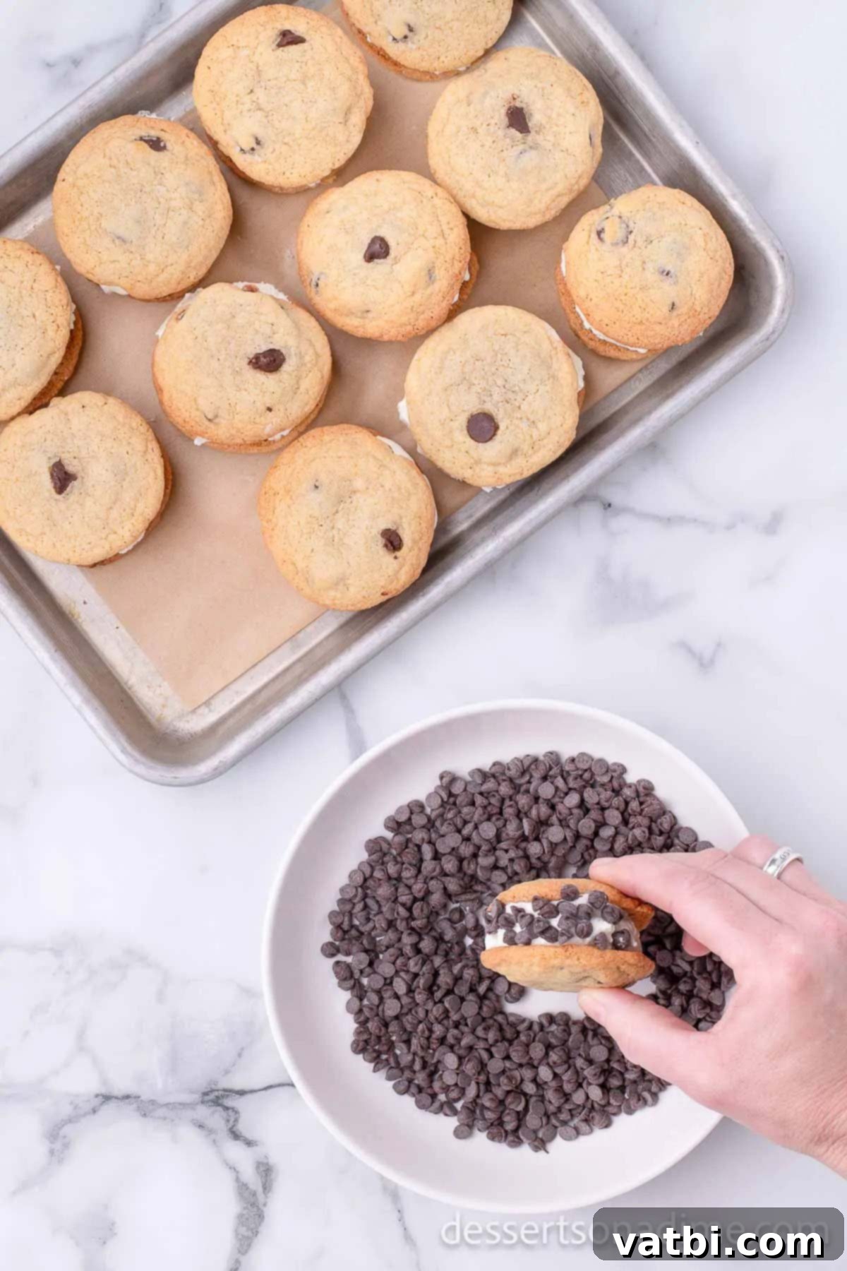 Perfect Homemade Chipwich Delight 14 Homemade Chipwich being rolled in a bowl of mini chocolate chips to coat the ice cream edges.