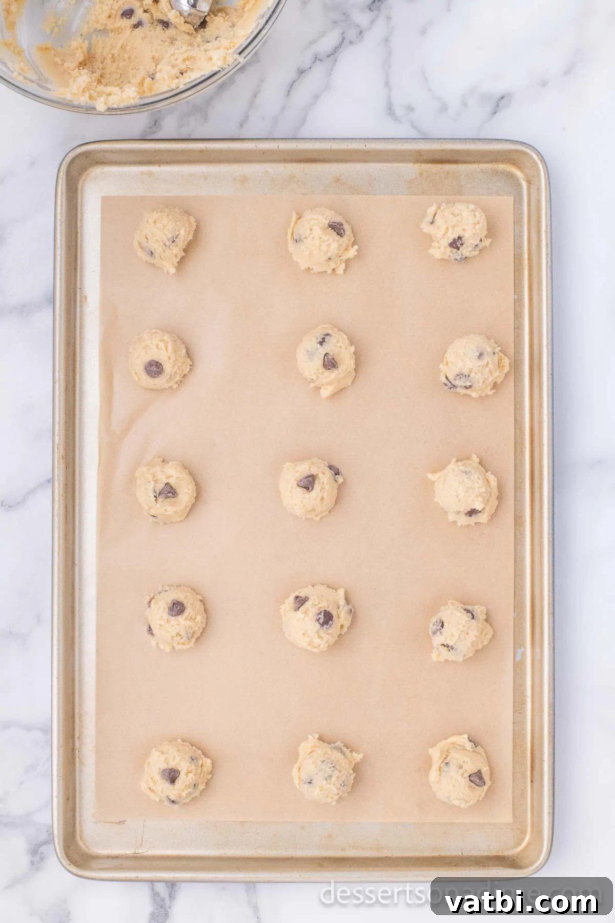 Perfect Homemade Chipwich Delight 9 Cookie dough balls neatly arranged on a baking sheet, ready for the oven.