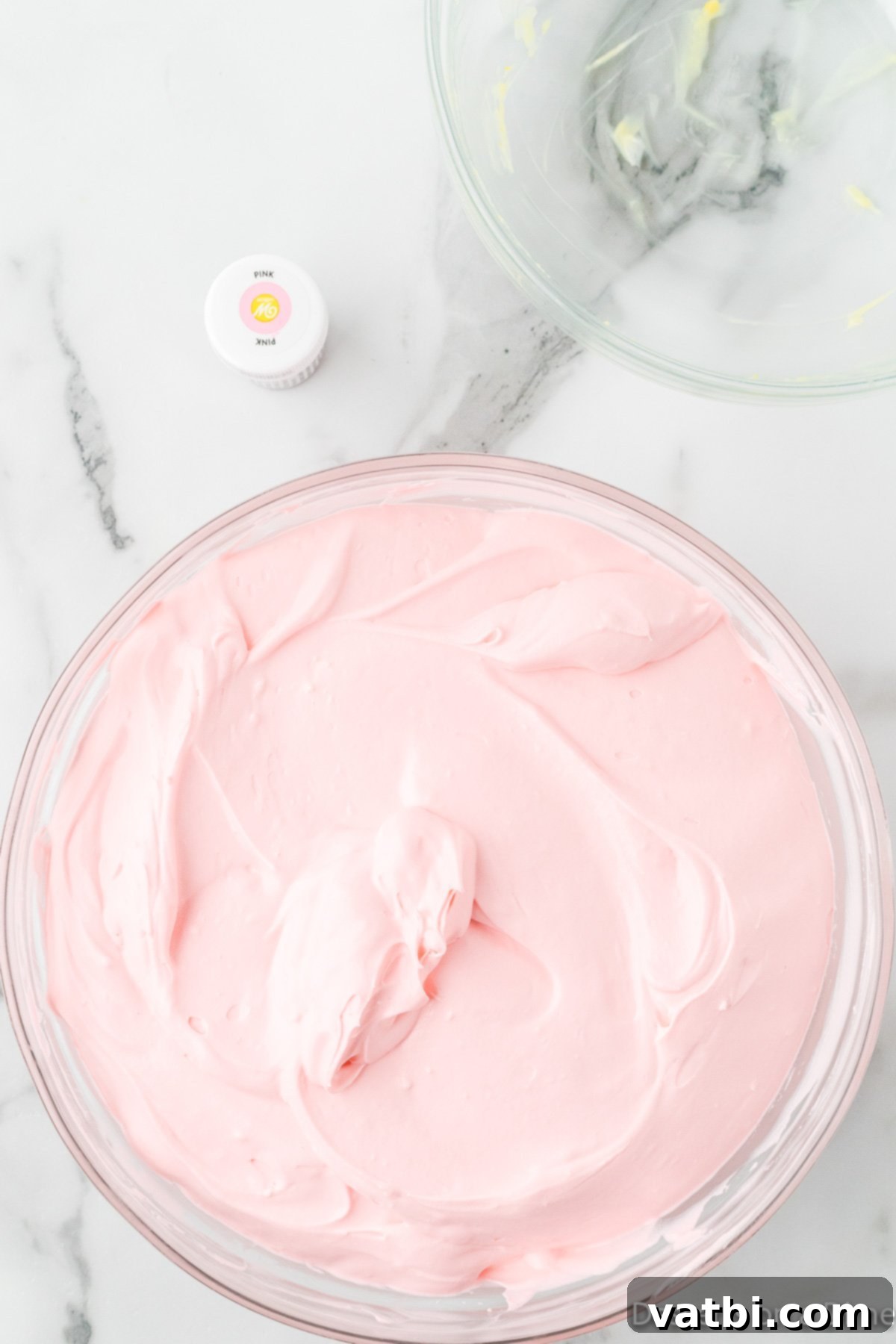 Pink food coloring added to mixture. 