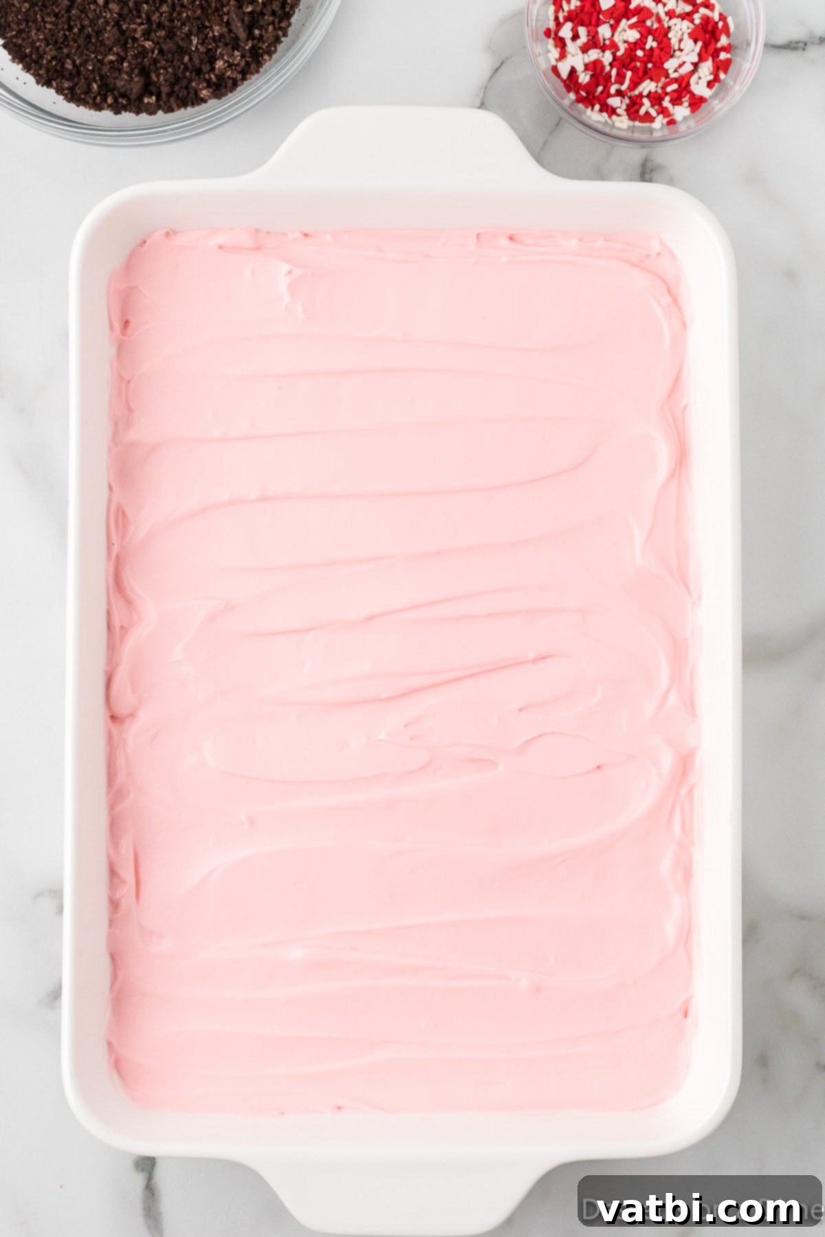 Pudding mixture spread in dish. 