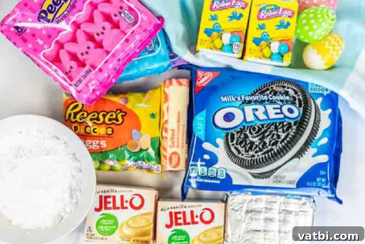 Easter dirt cake is an easy and delicious no bake treat perfect for dessert on Easter. This fun dessert is decorated with Easter peeps, candy and more. A flat lay image showing the ingredients for Easter dirt cake: Oreo cookies, softened cream cheese, powdered sugar, Cool Whip, instant vanilla pudding mix, and various colorful Easter candies.