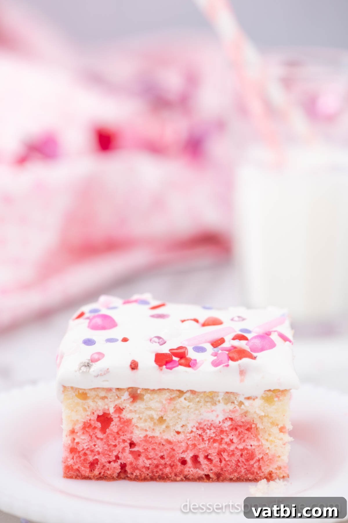 Sweet Valentine's Poke Cake 2 Slice of Valentine's Day Poke Cake on plate.