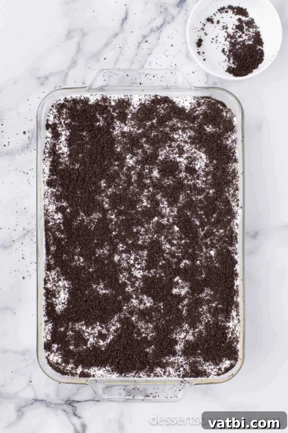 Simple Cream Cheese Free Dirt Cake 8 Cookie crumbs in baking dish.