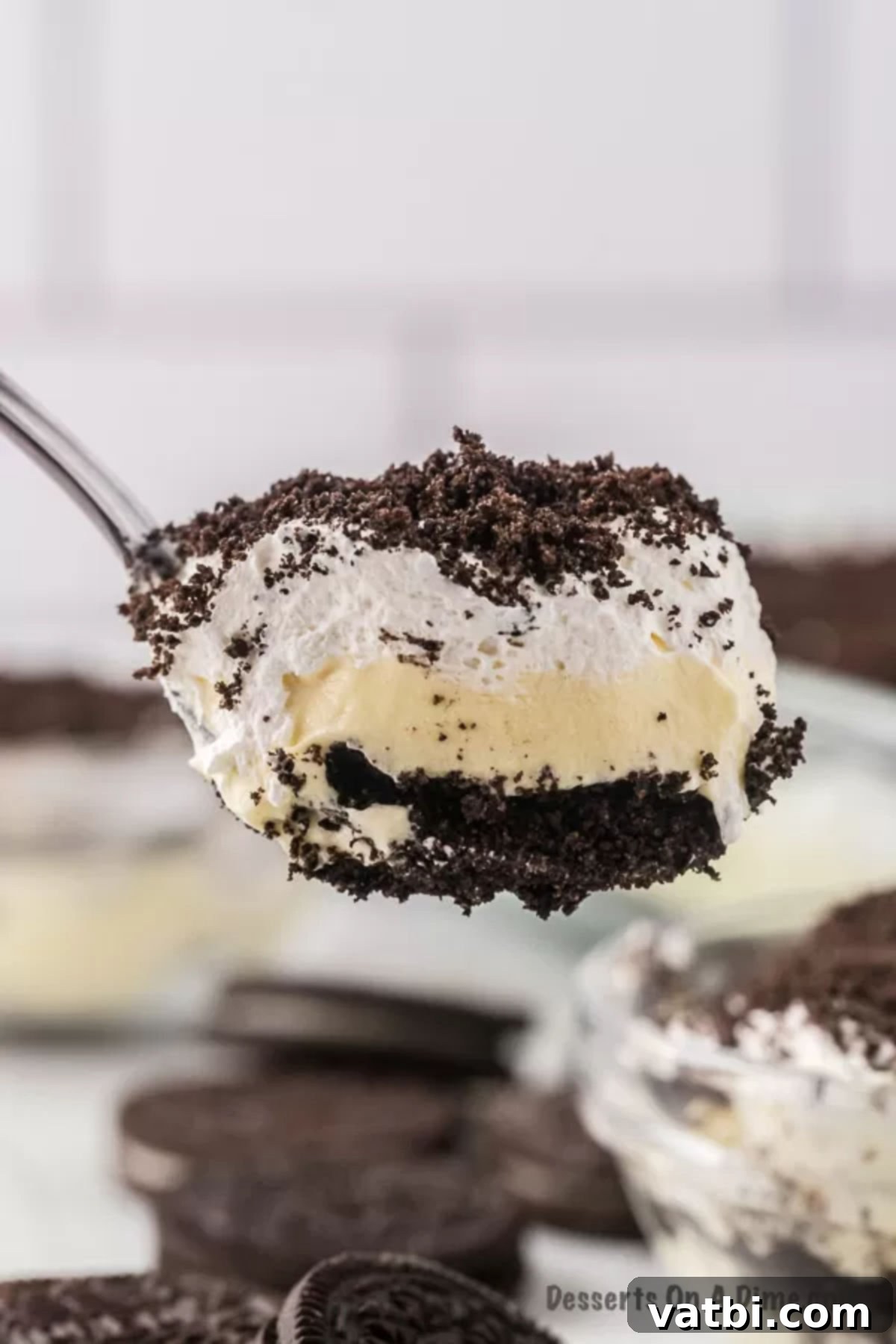Simple Cream Cheese Free Dirt Cake 9 Spoon serving dirt cake.