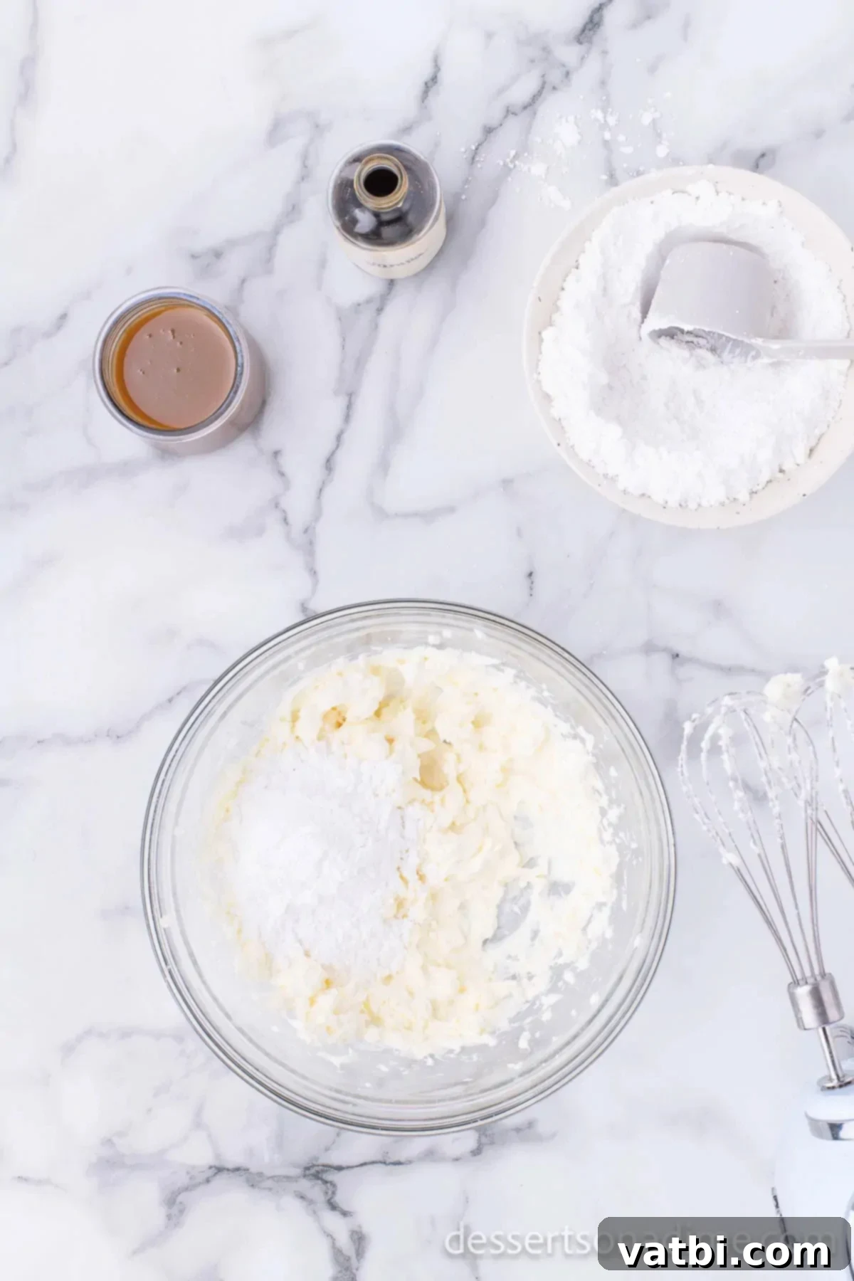 Irresistible Salted Caramel Pie 4 Cream cheese and powdered sugar in a mixing bowl, ready to be beaten.