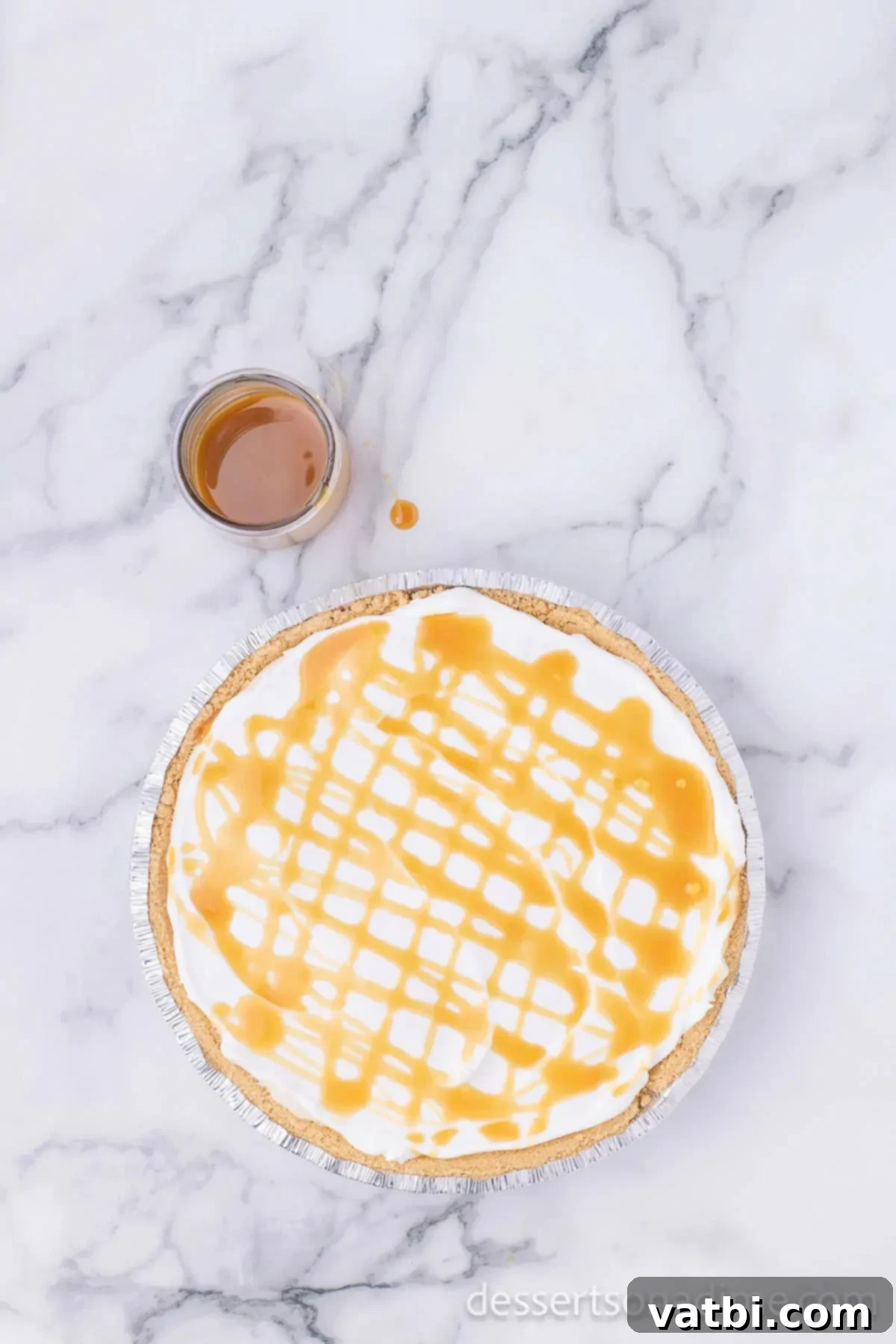 Irresistible Salted Caramel Pie 9 Caramel sauce drizzled on top of the pie, over the whipped topping.