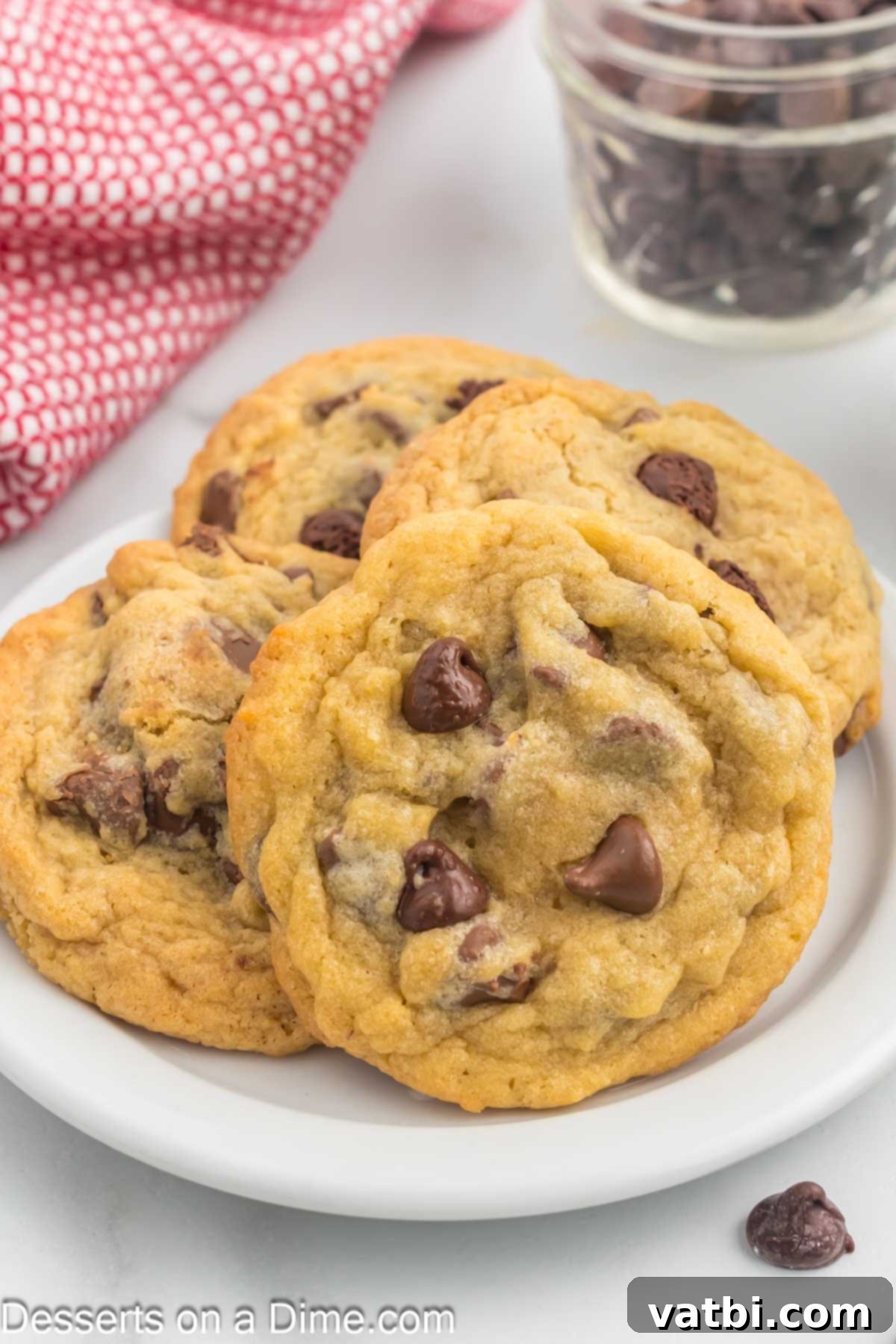 Irresistibly Soft Chocolate Chip Pudding Cookies 10 Close-up of freshly baked chocolate chip pudding cookies, soft and delicious, arranged on a white platter.