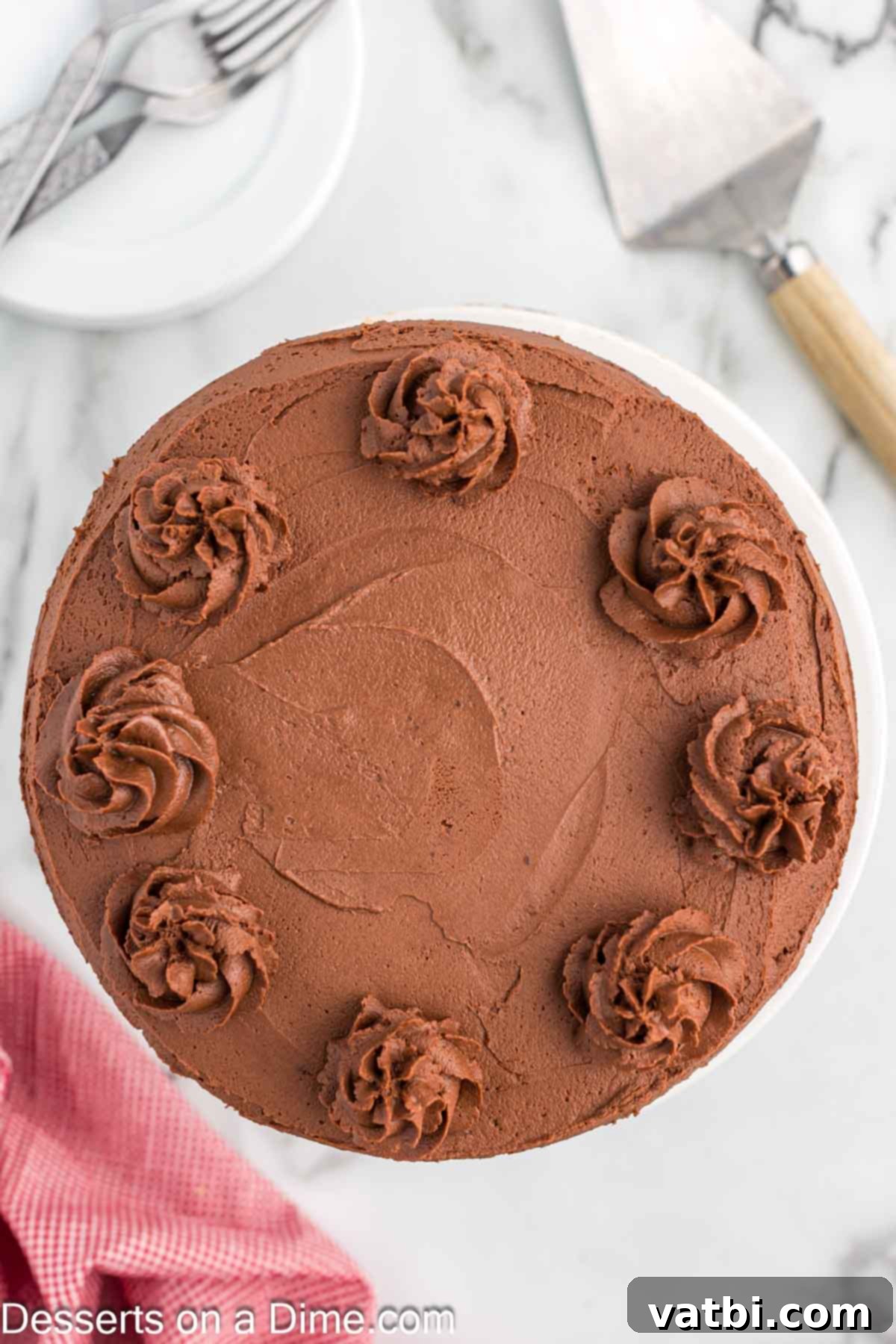 Decadent Keto Chocolate Delight 9 A full, gorgeously frosted Keto Chocolate Cake, artfully garnished and sitting on a cake stand, ready to be enjoyed as a centerpiece dessert.
