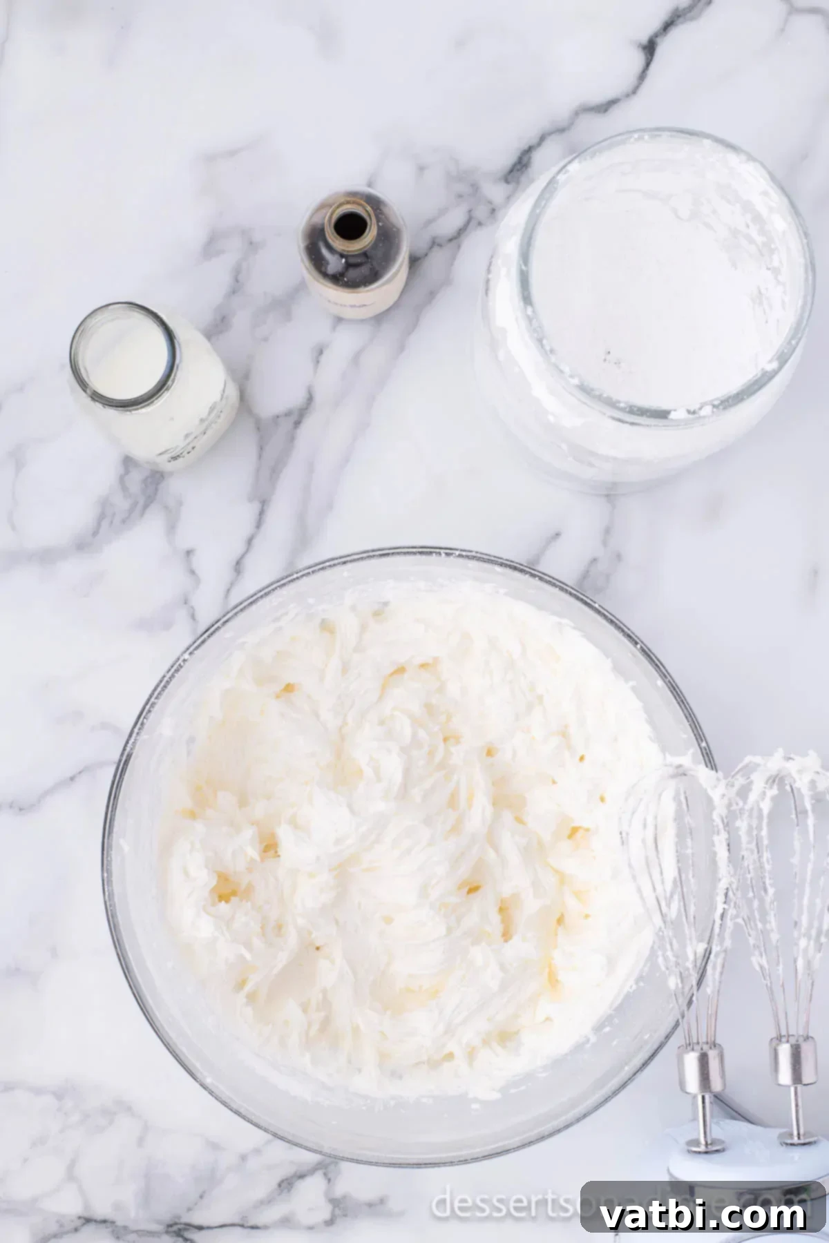 Heavenly Strawberry Crunch Cake 6 Mixing bowl with butter and powdered sugar combined together.
