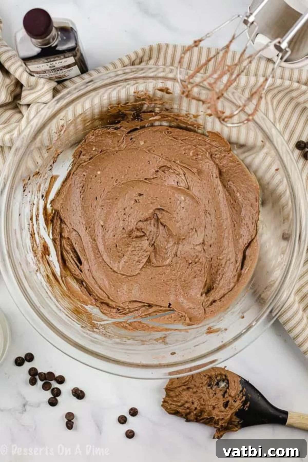 A close-up image showing a bowl of perfectly whipped and smooth keto chocolate frosting, ready to be used.