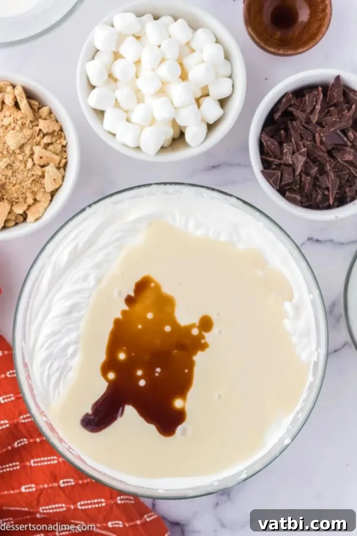 Irresistible Homemade S'mores Ice Cream 4 Mixing bowl with sweetened condensed milk and vanilla.