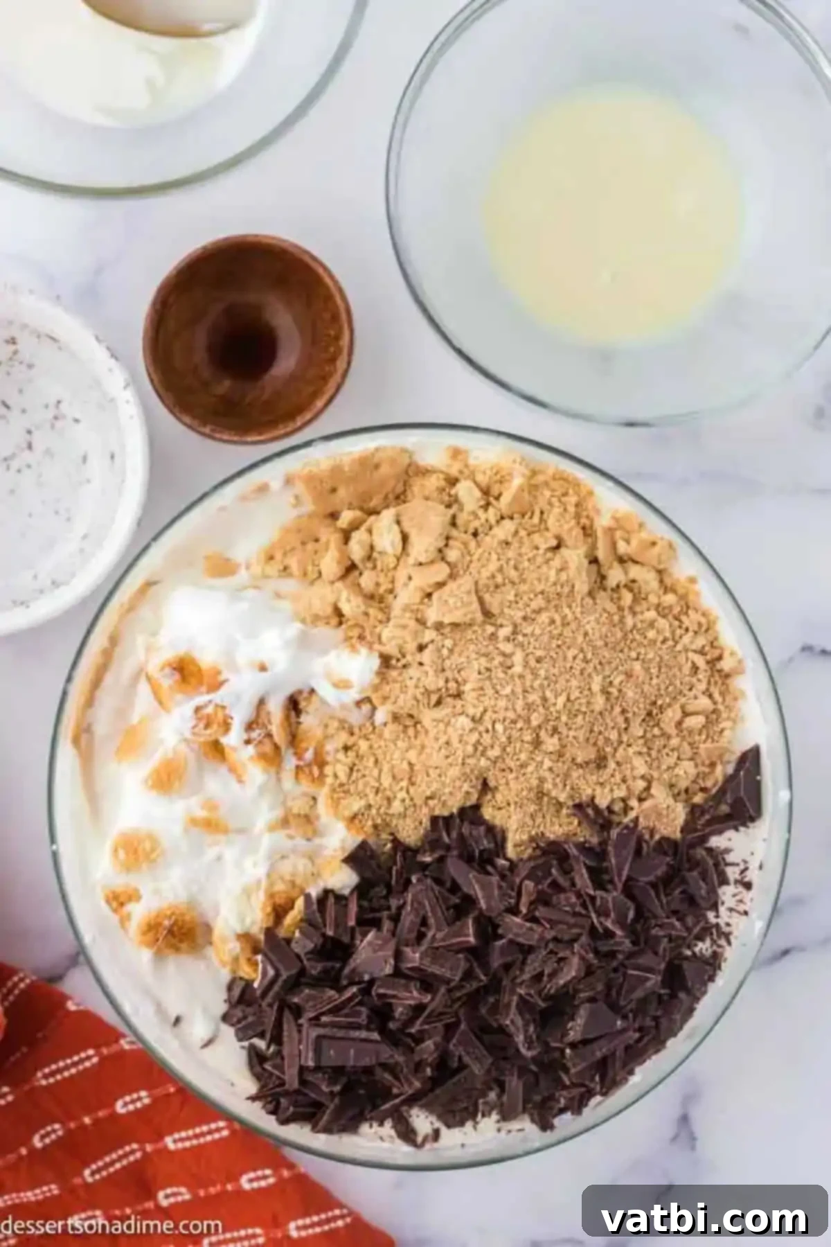 Irresistible Homemade S'mores Ice Cream 5 Marshmallows and graham crackers added to ice cream mixture.