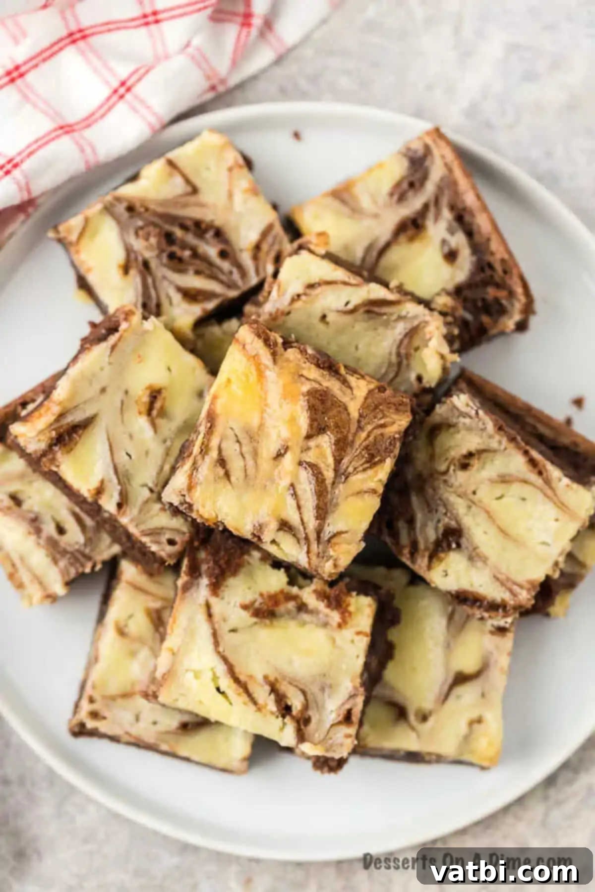 Decadent Cream Cheese Swirl Brownies 7 Cream cheese brownies cut into squares.