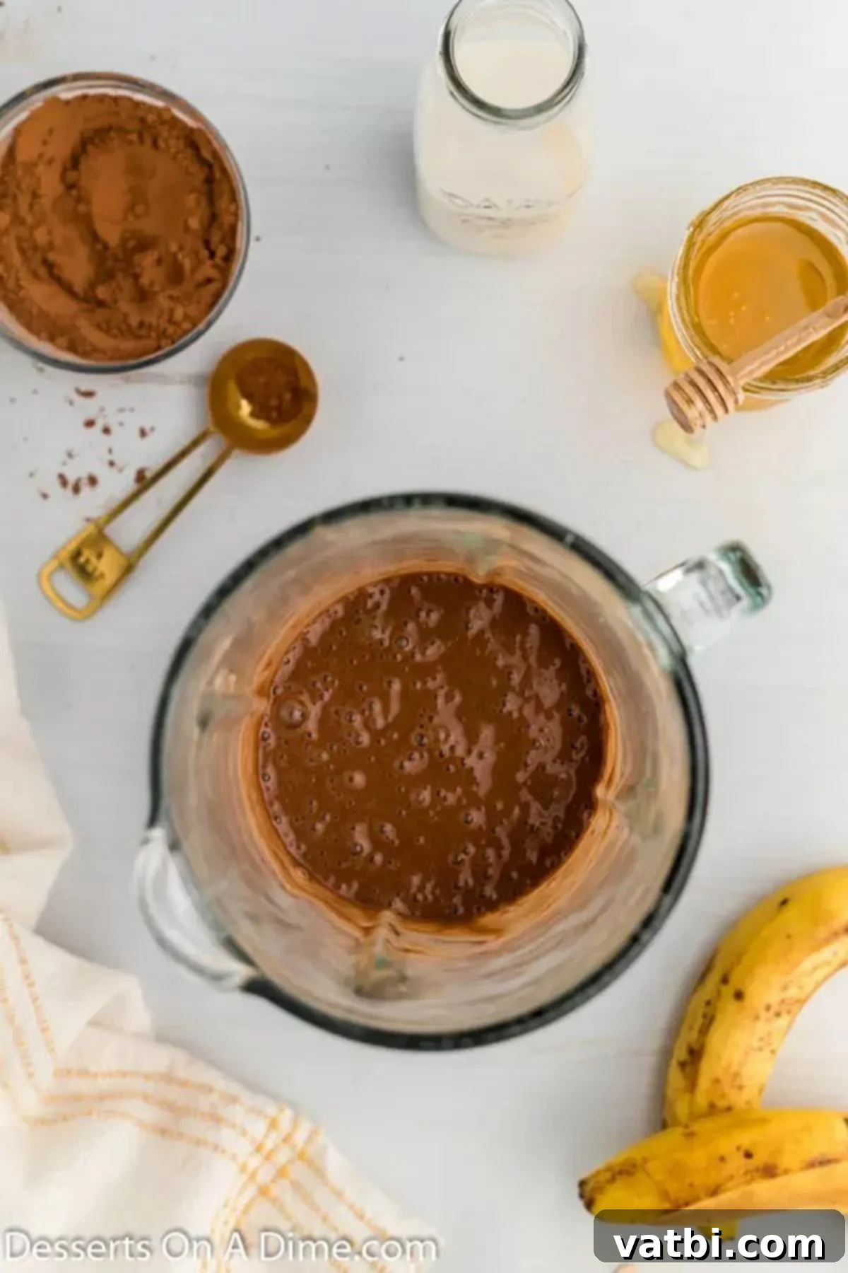 Ultimate Chocolate Banana Pops 5 Smooth chocolate banana mixture in a blender, ready to be poured into molds.