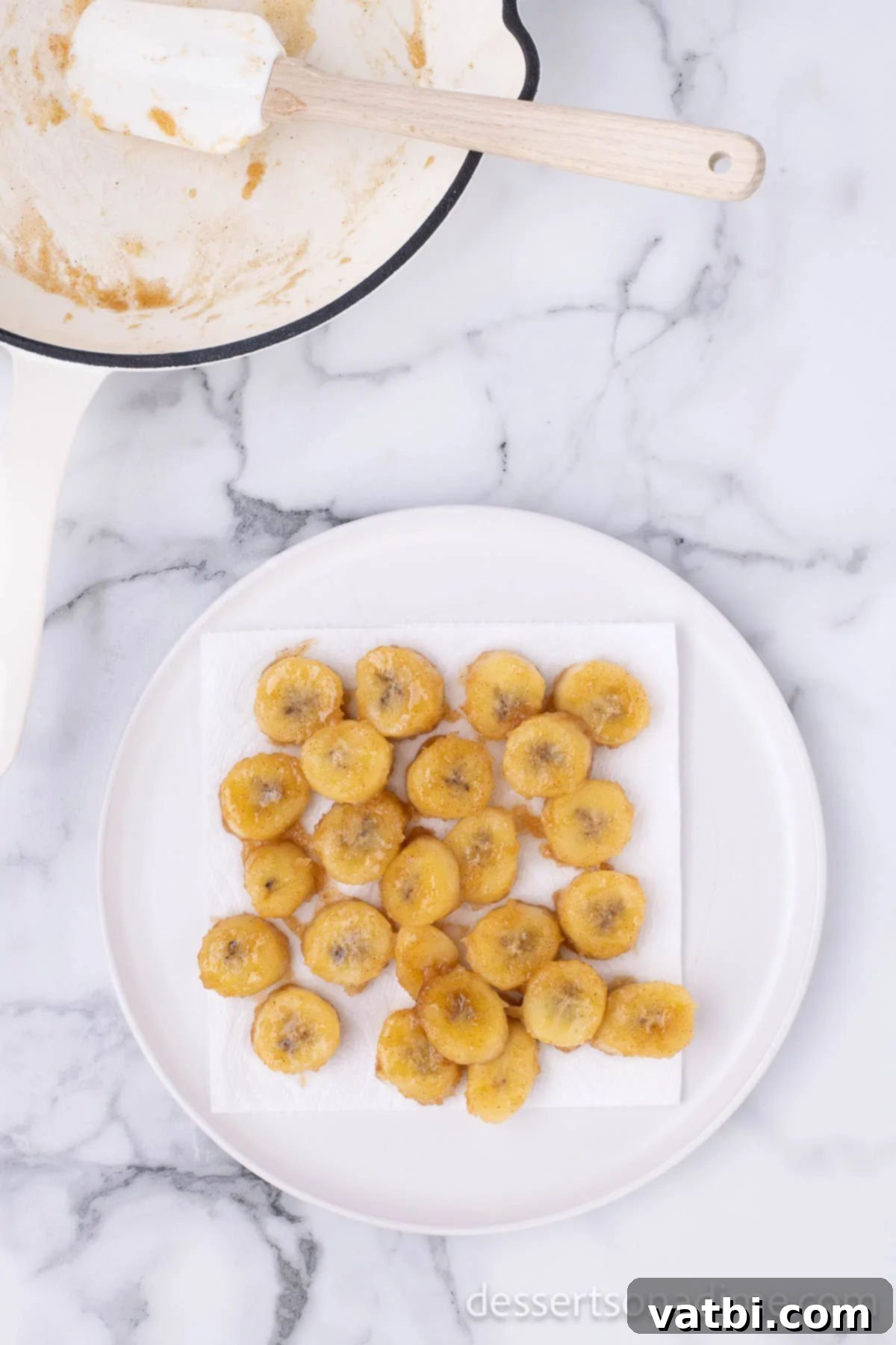Sweet Golden Banana Bites 7 Cooked, golden-brown fried bananas transferred to a plate, ready to be served.