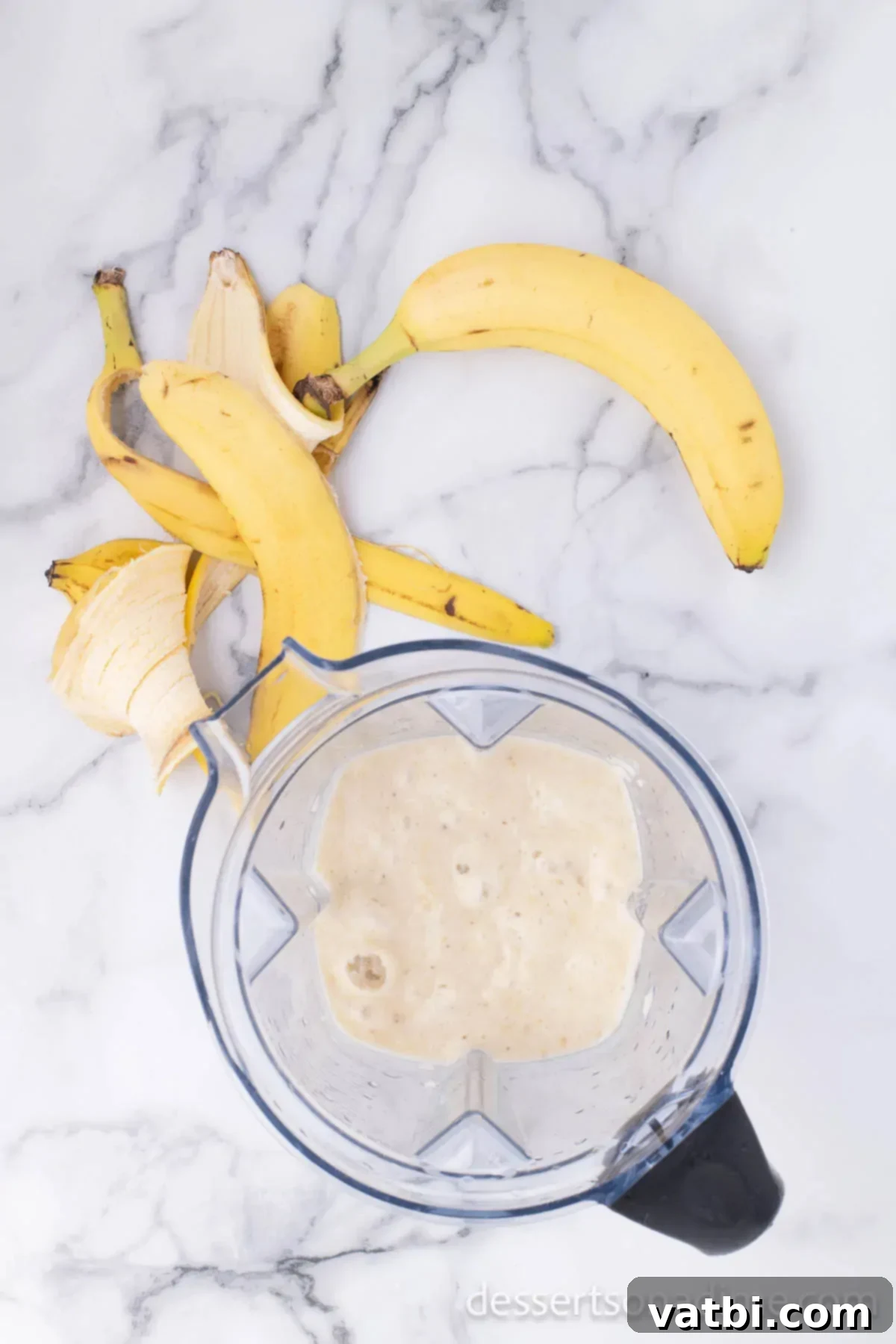 Primate's Perfect Scoop 5 Ripe bananas being pureed in a blender.