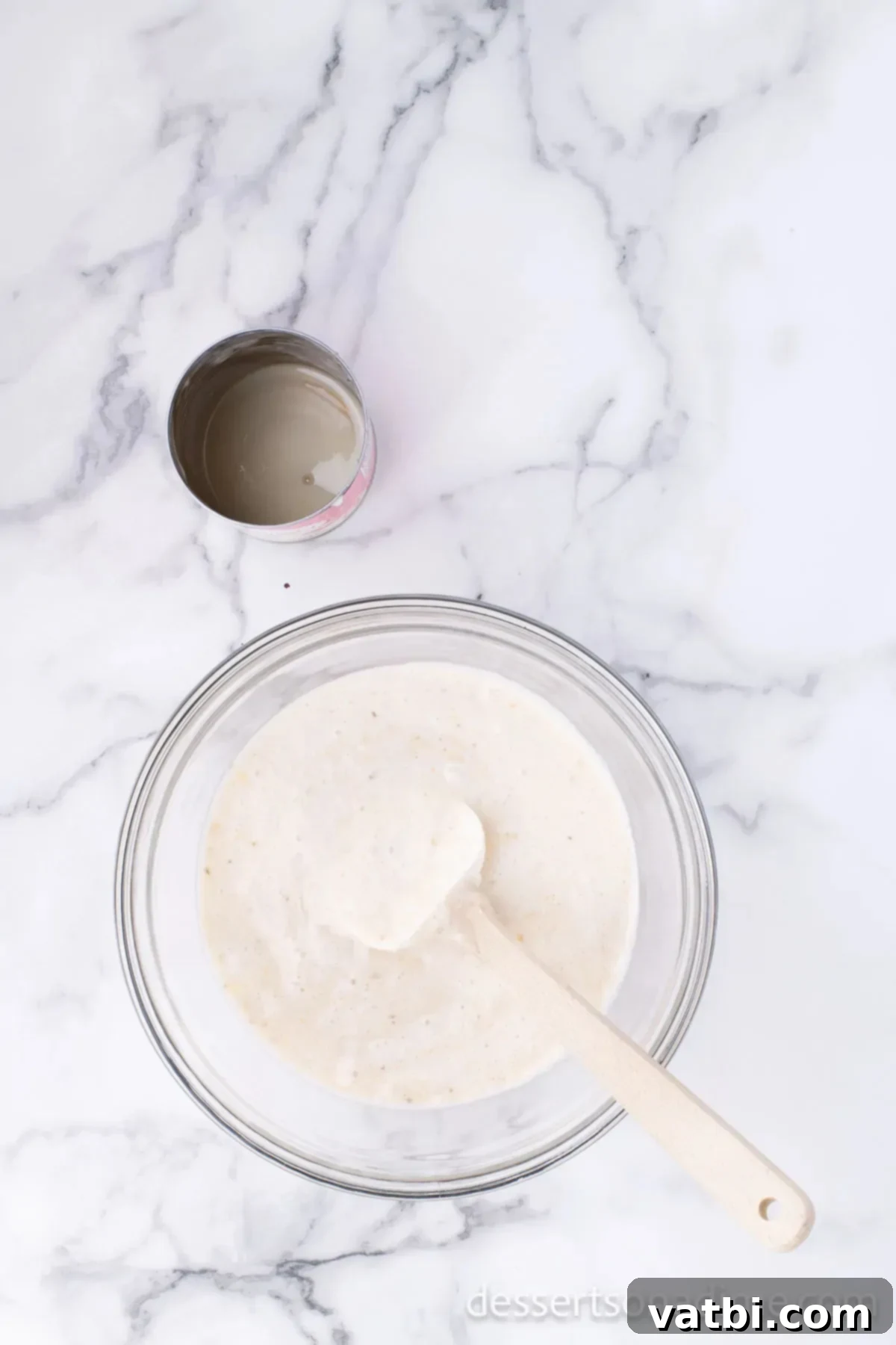 Primate's Perfect Scoop 6 Sweetened condensed milk and pureed bananas combined in a separate bowl.