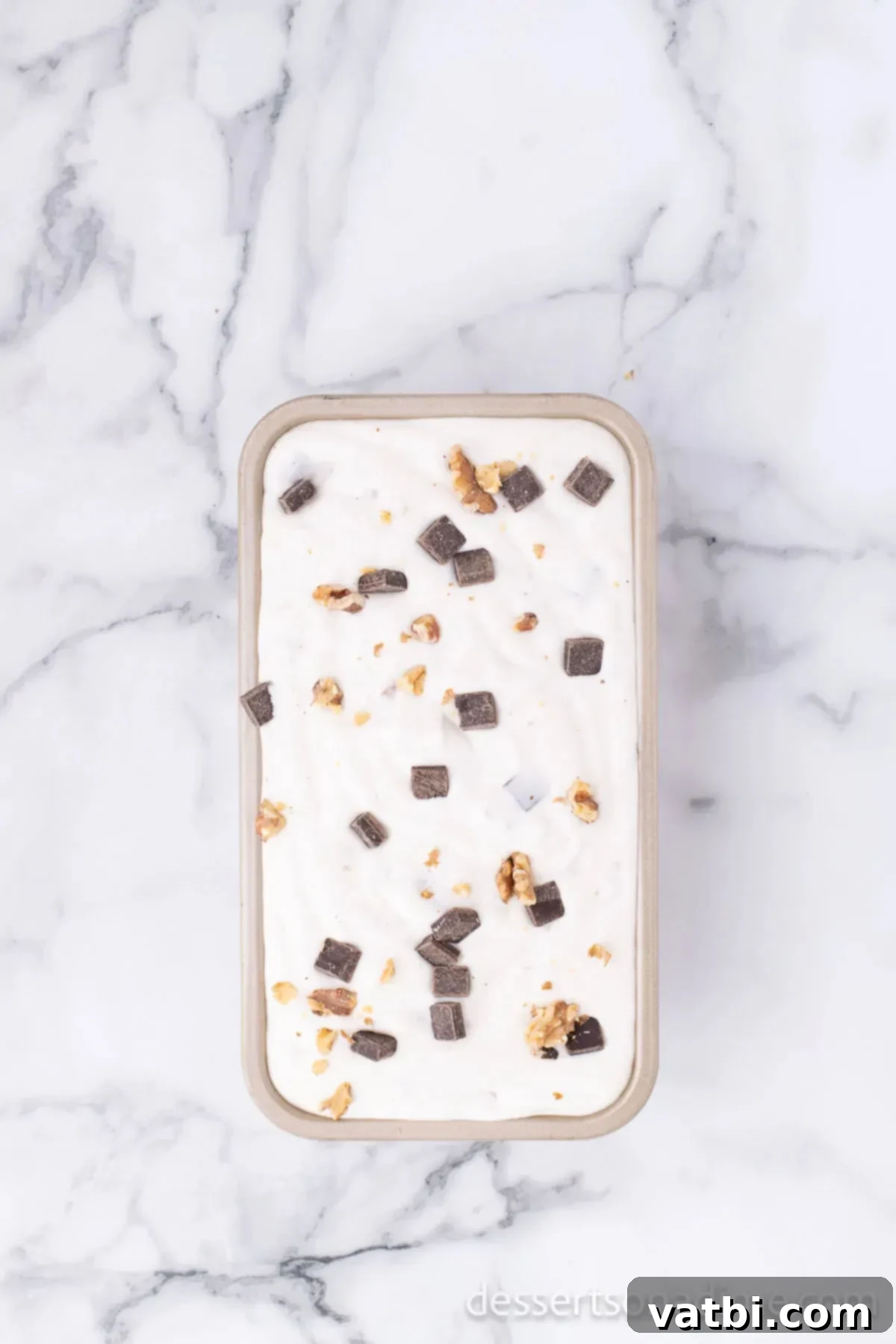 Primate's Perfect Scoop 8 Ice cream mixture spread evenly into a loaf pan, ready for freezing.
