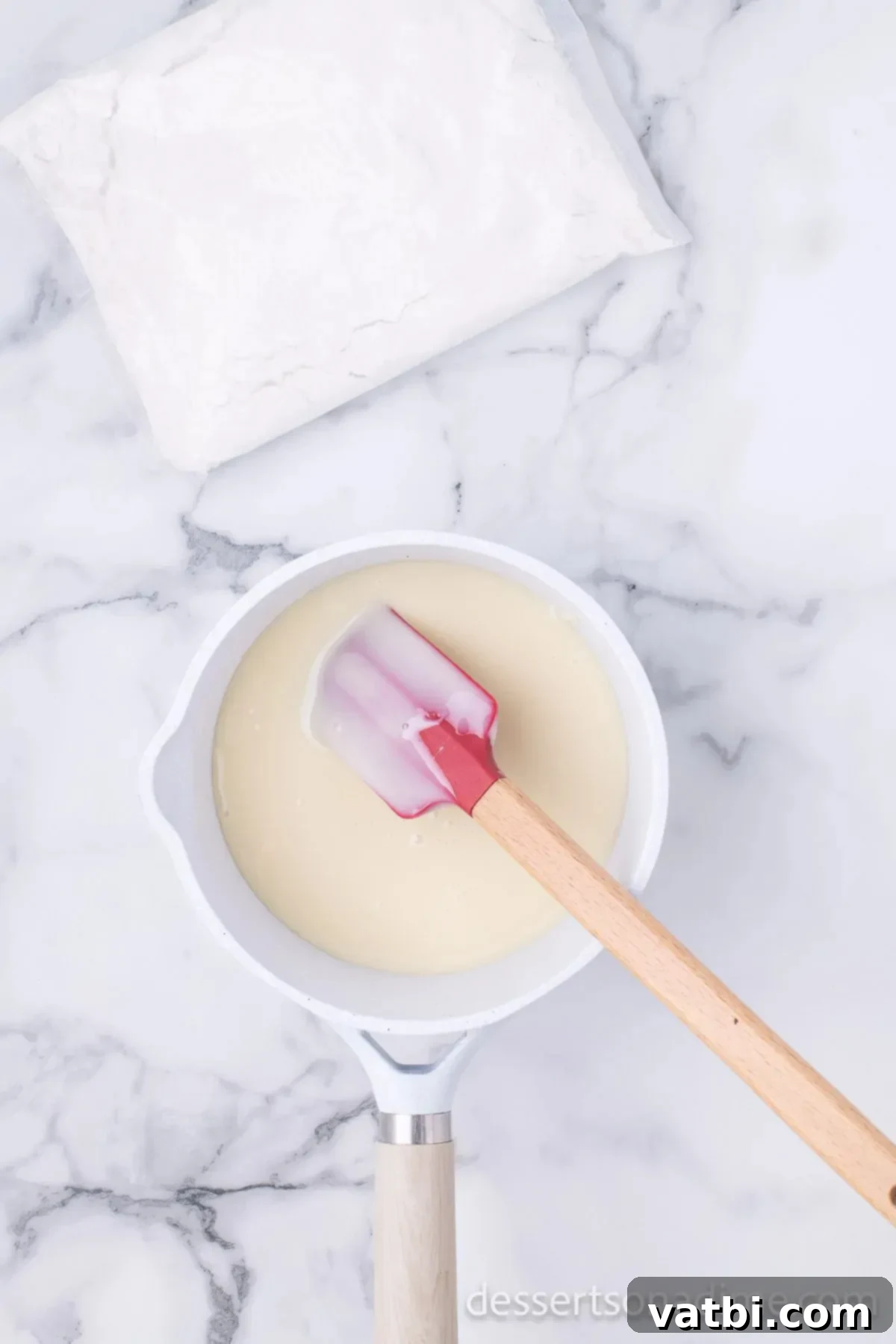Ultimate Sugar Cookie Fudge 5 Melted mixture in a saucepan, smooth and fully combined, ready for the next ingredients.