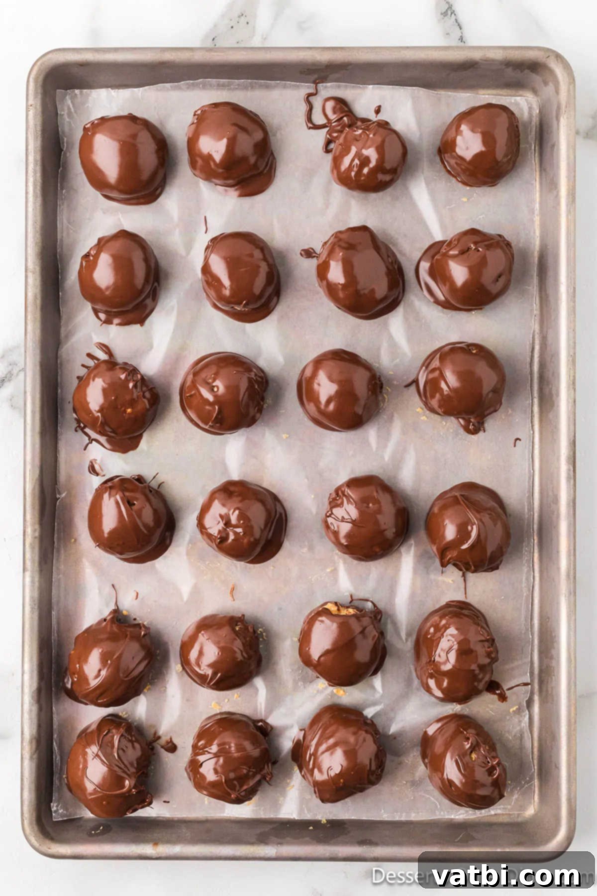 Peanut Butter Crisp Bites 14 Peanut Butter Balls on baking sheet.