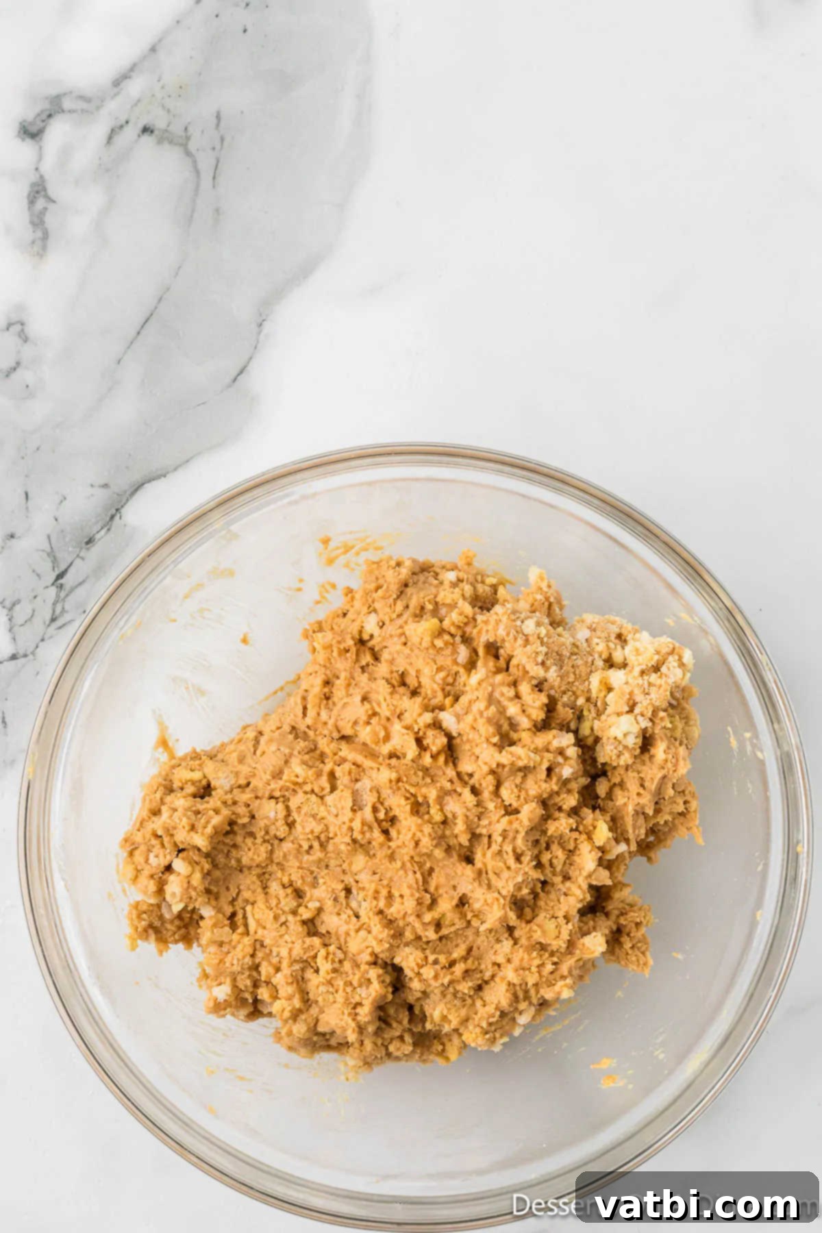 Peanut Butter Crisp Bites 8 Mixture combined together in bowl.