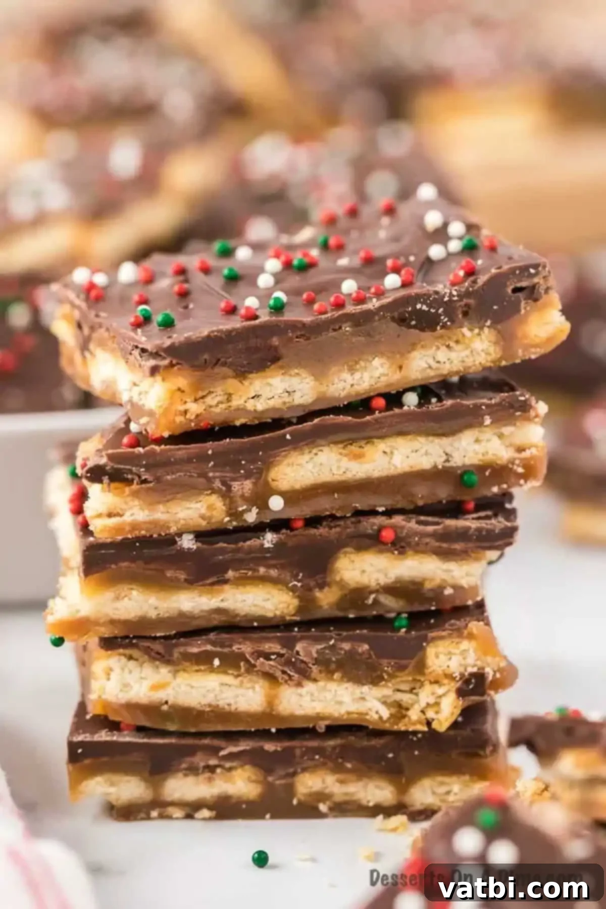 Sweet & Salty Ritz Toffee Bites 2 Ritz Cracker Toffee stacked into pieces.