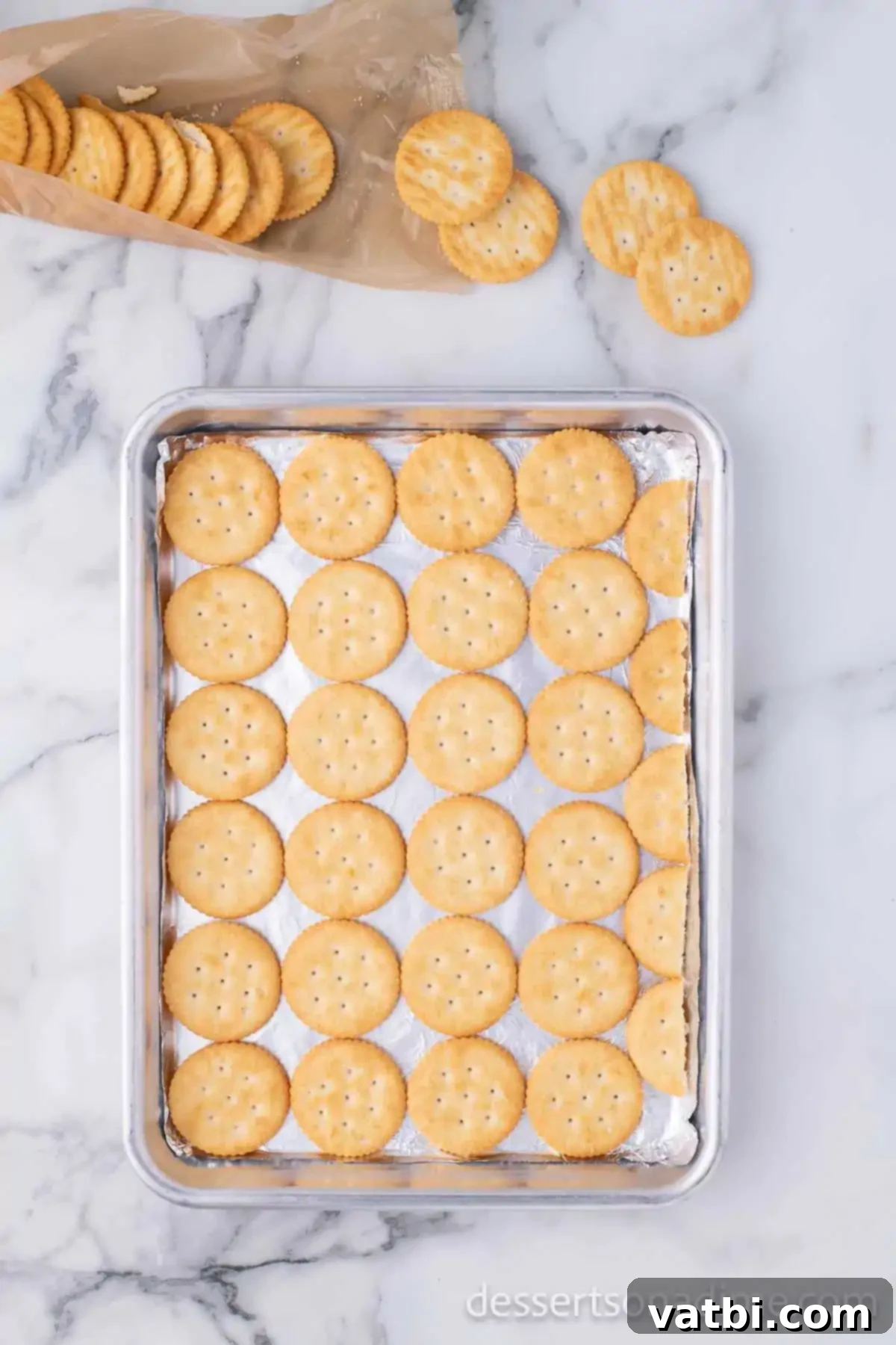 Sweet & Salty Ritz Toffee Bites 4 Baking sheet of crackers.