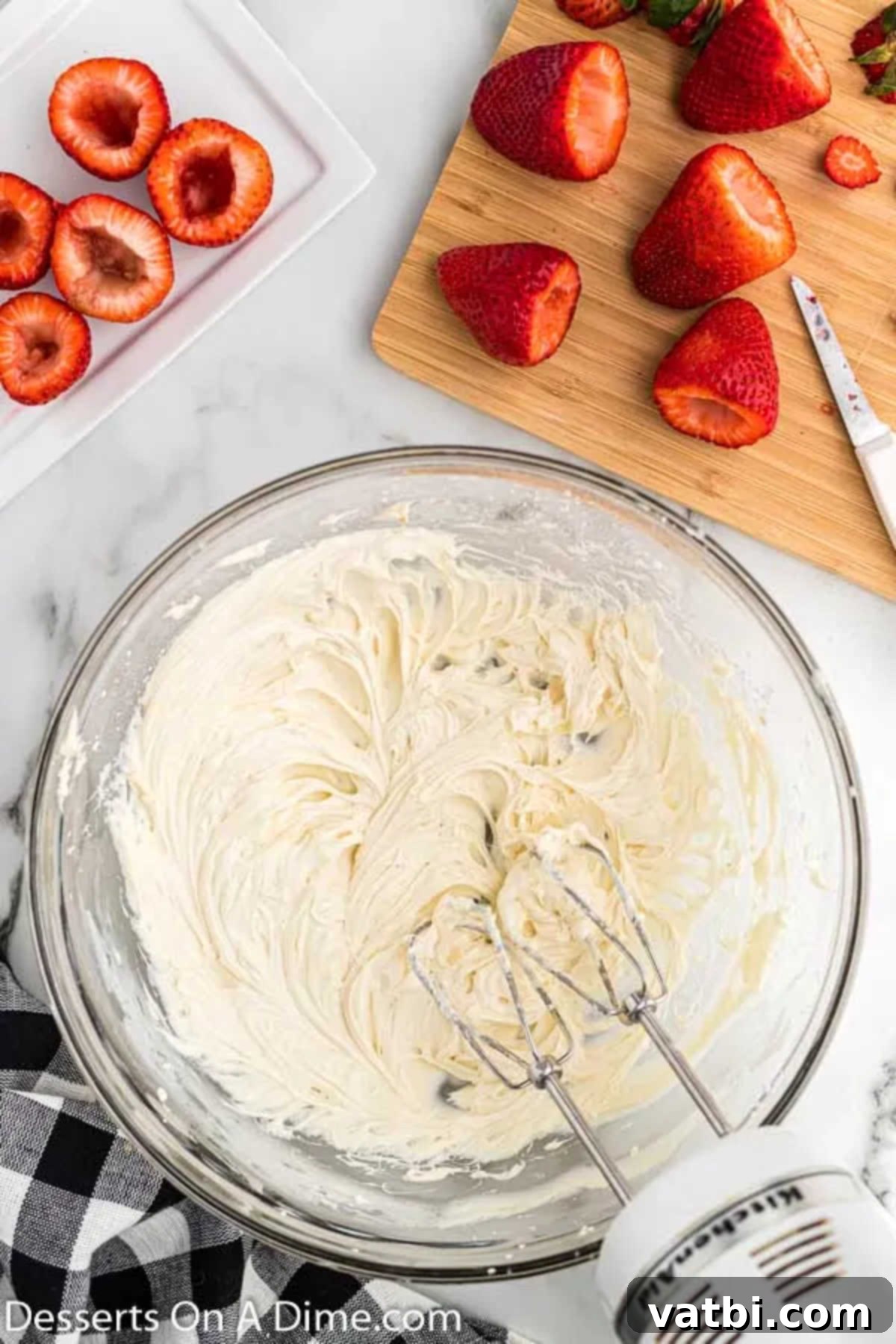 Decadent Cheesecake Filled Strawberries 5 Cheesecake filling ingredients combined in a mixing bowl, ready to be beaten.