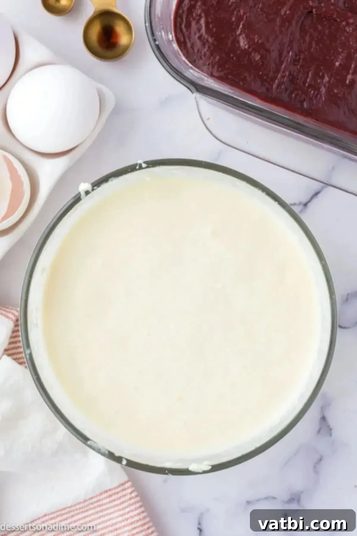 Cheesecake mixture combined in a bowl, smooth and creamy.