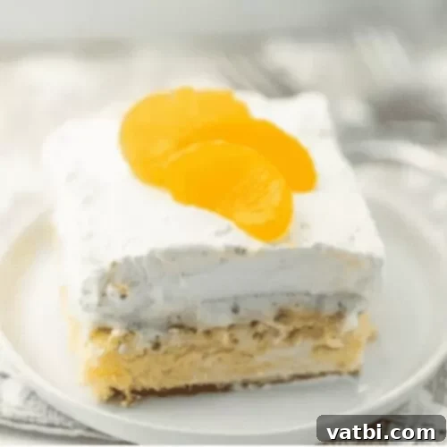 A slice of light and airy mandarin orange angel food cake, perfect for a refreshing dessert.