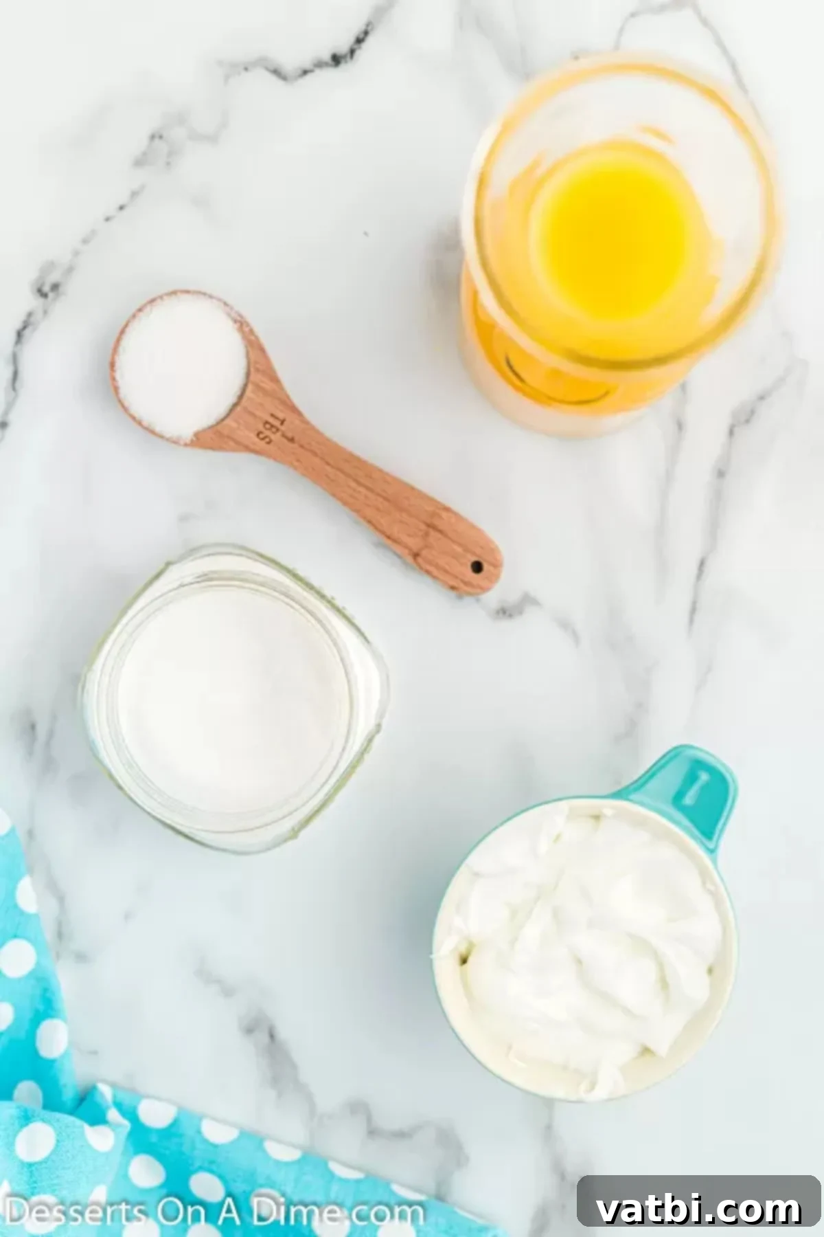 Orange Swirl Dream Pop 3 Ingredients for Orange creamsicle popsicles - orange juice, Greek Yogurt, granulated sugar.