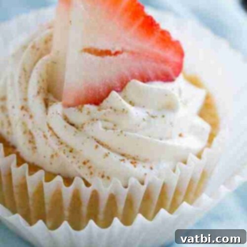 Sweet and Simple Mexican Delights 6 Tres Leches Cupcakes topped with whipped cream and a sprinkle of cinnamon.