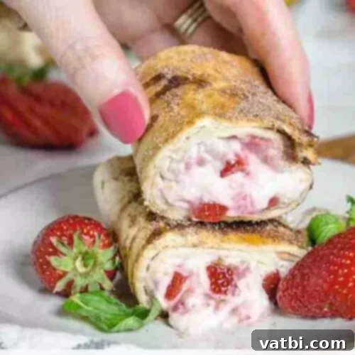 Sweet and Simple Mexican Delights 4 Air Fryer Strawberry Cheesecake Chimichangas with a dusting of powdered sugar.