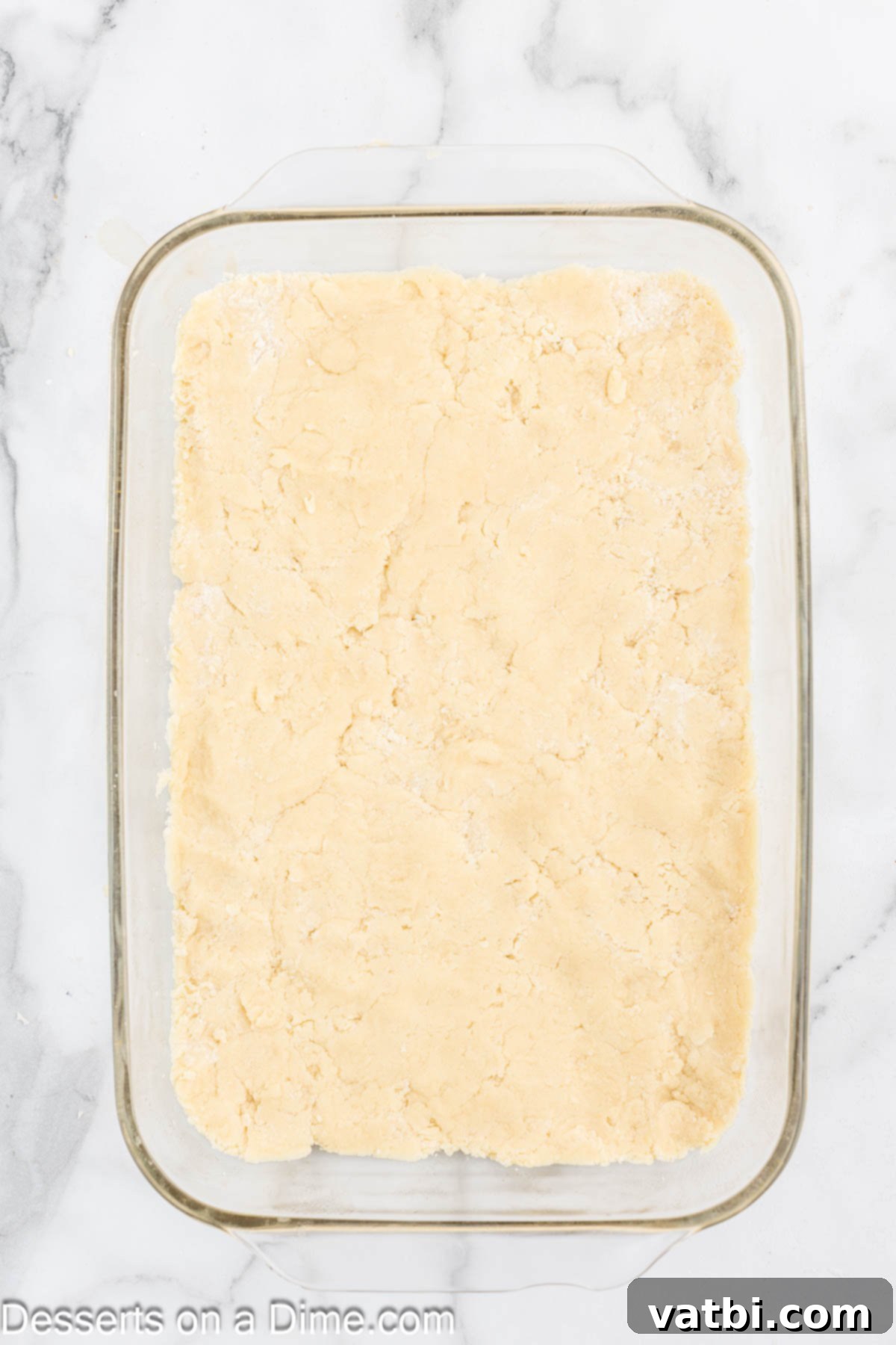 Homemade Sugar Cookie Squares 6 Sugar cookie dough pressed into a baking pan.