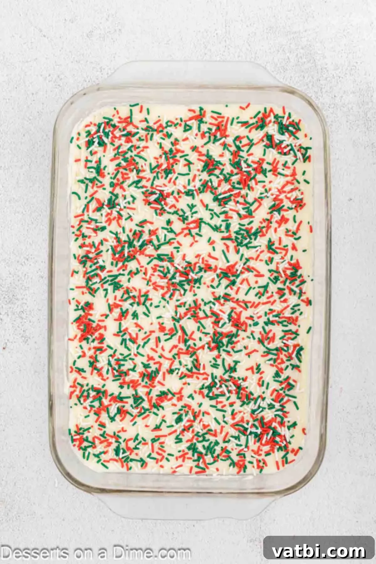 Frosted Christmas Sugar Cookie Bars 9 Sprinkles added on top of the frosting.