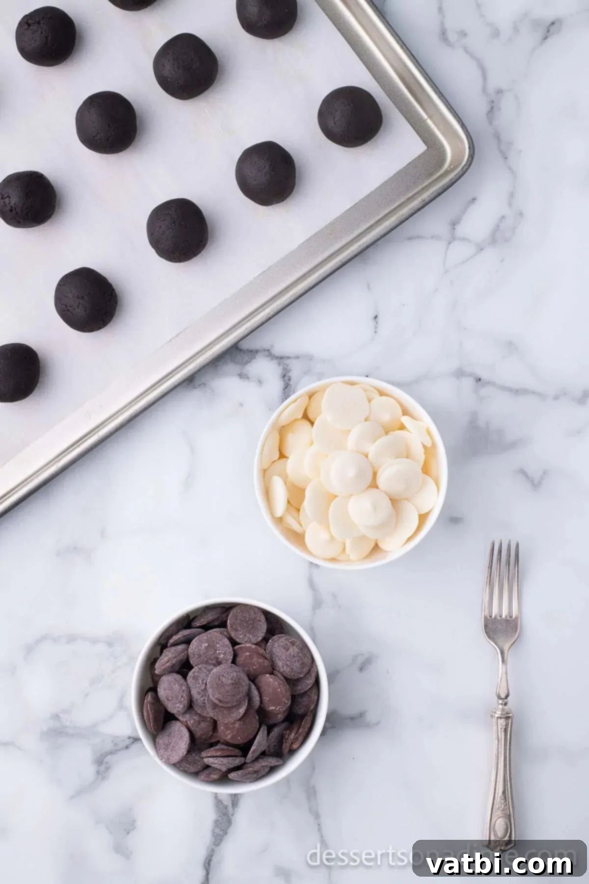 Easy Christmas Oreo Balls 8 Bowls of melted dark and white chocolate dipping wafers.