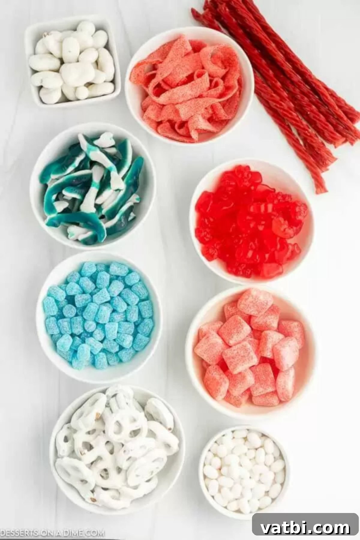 Star Spangled Sweet Treat Board 3 Assorted red, white, and blue candies, treats, and nuts laid out for an American flag candy charcuterie board.