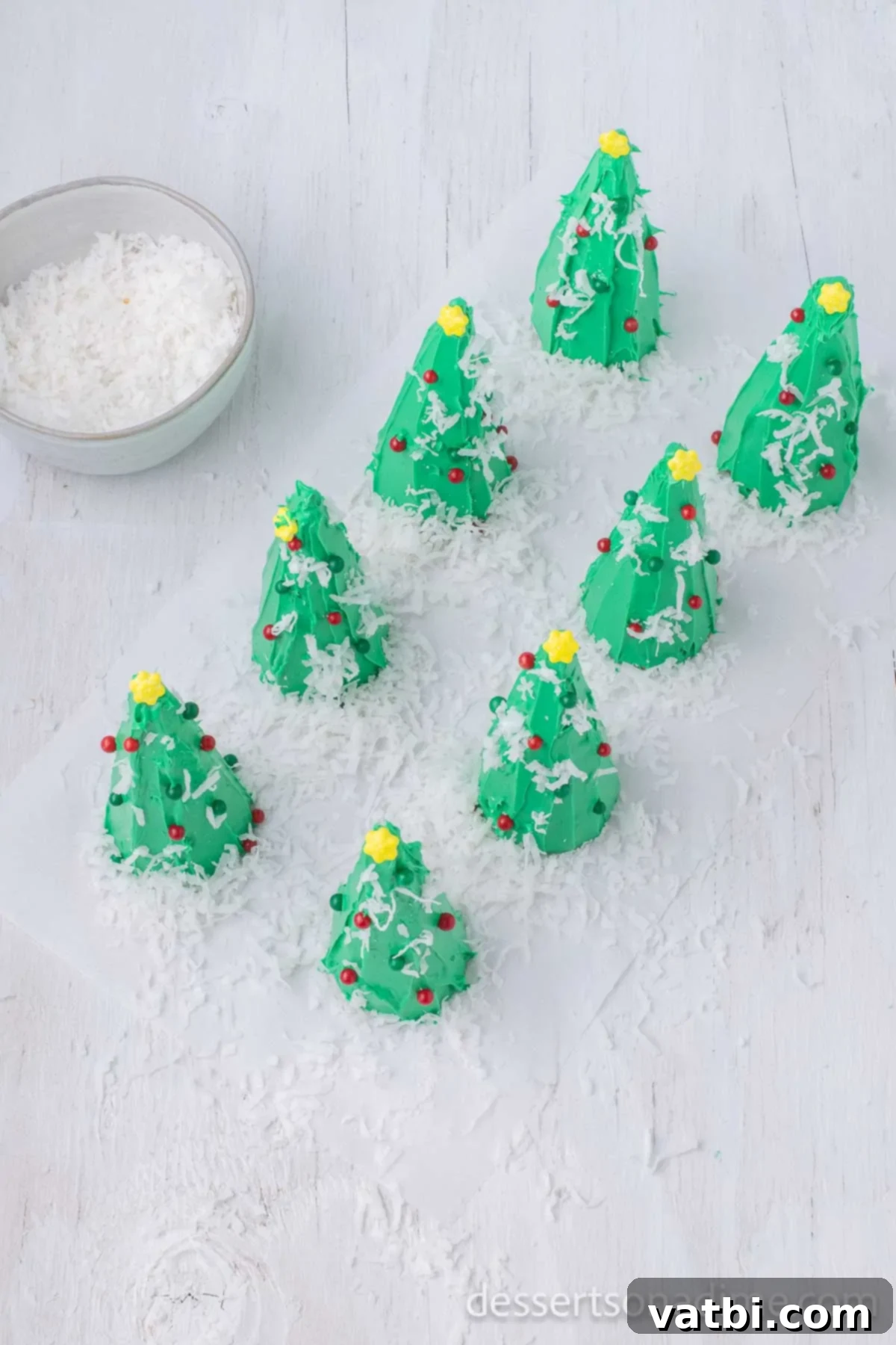 Sweet Ice Cream Cone Christmas Trees 9 Shredded coconut sprinkled on top of decorated ice cream cone Christmas trees to simulate snow.